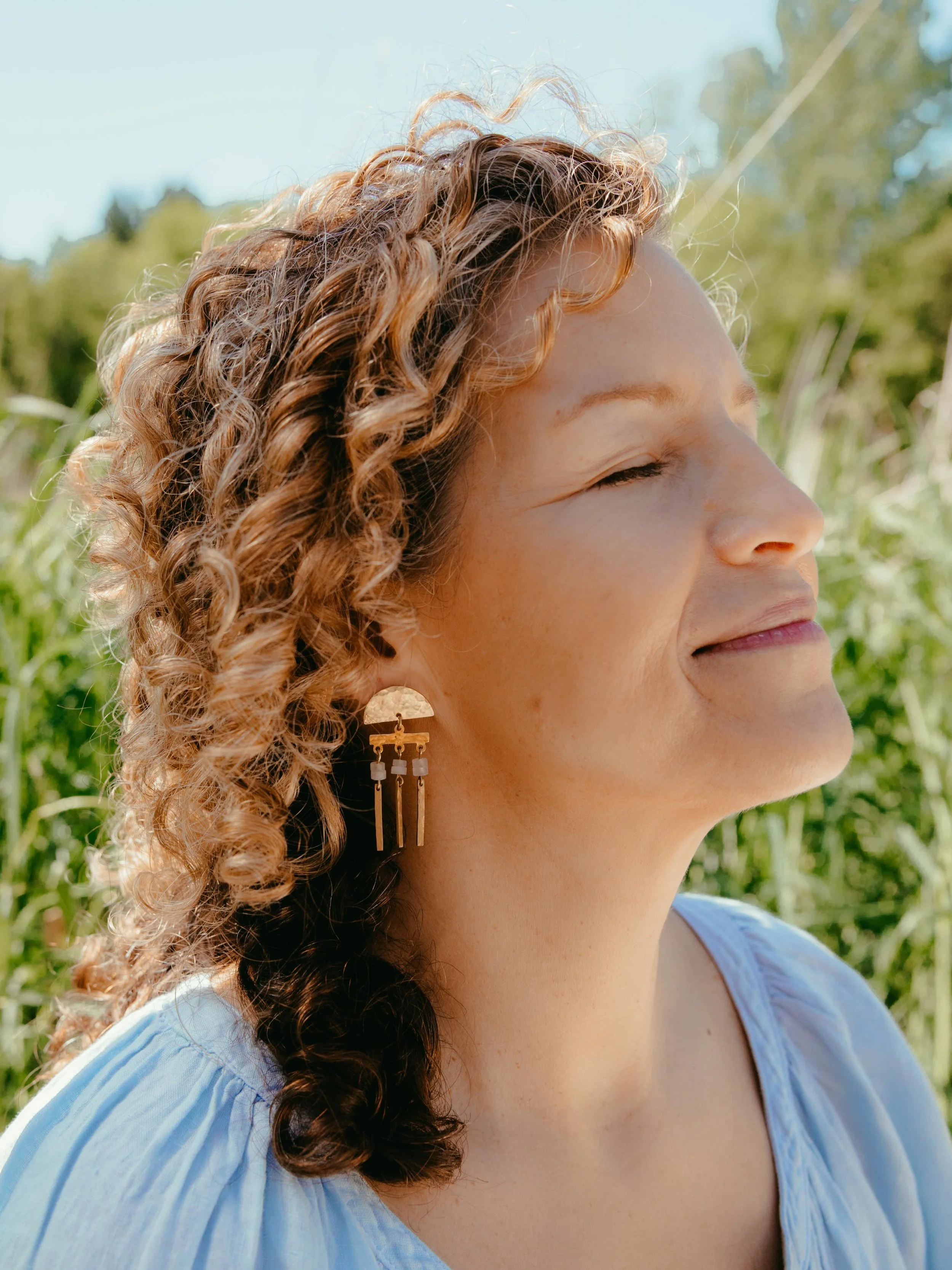 The final chapter is almost here and we saved something special for last. 

Meet Linea. A hammered brass half-moon with delicate stone drops and gold bar fringe that moves the most beautiful way. She&rsquo;s coming in two stones: pink quartz and turq