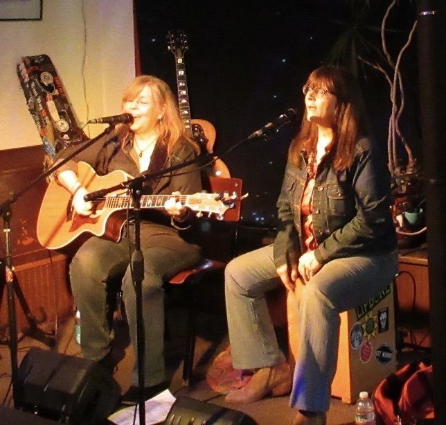 The Keller sisters playing on the stage at Ugly Mug