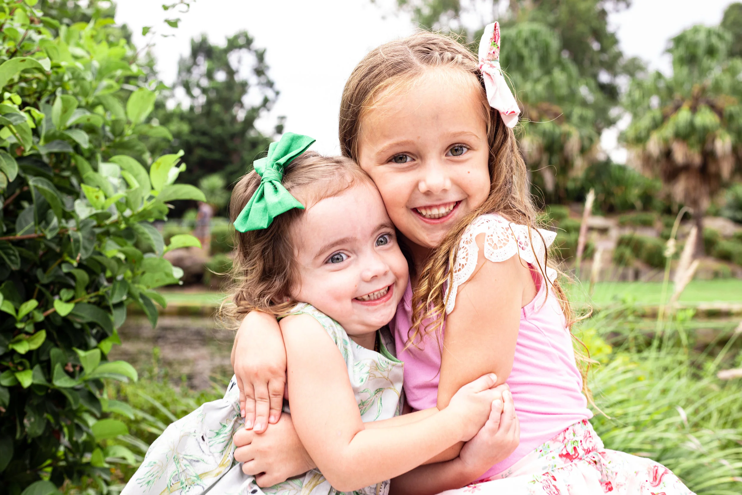 Two adorable loving sisters at Nurragingy Reserve