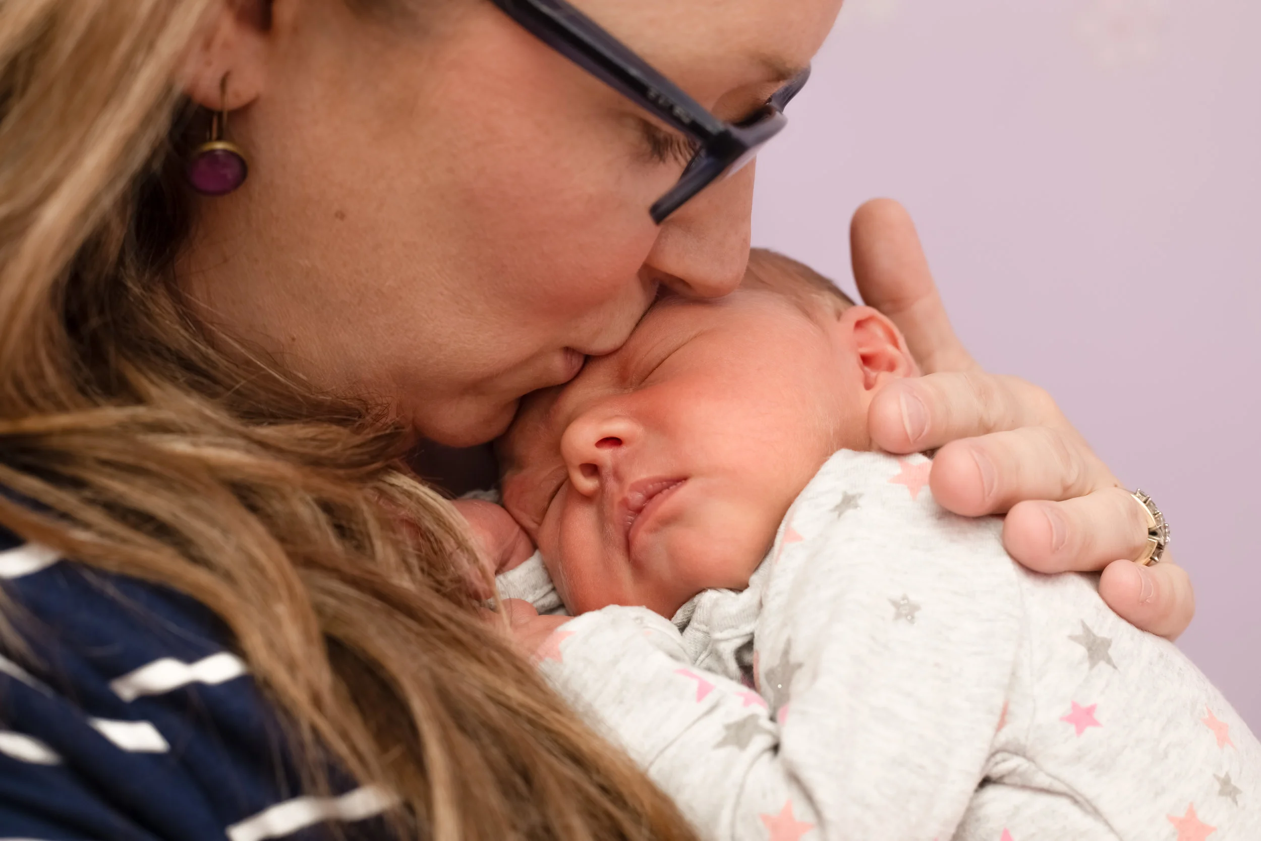 This gorgeous touching moment was captured in the family home.