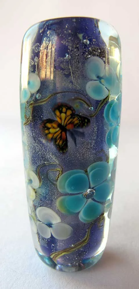 Large purple floral bead with butterfly and cubic zirconia