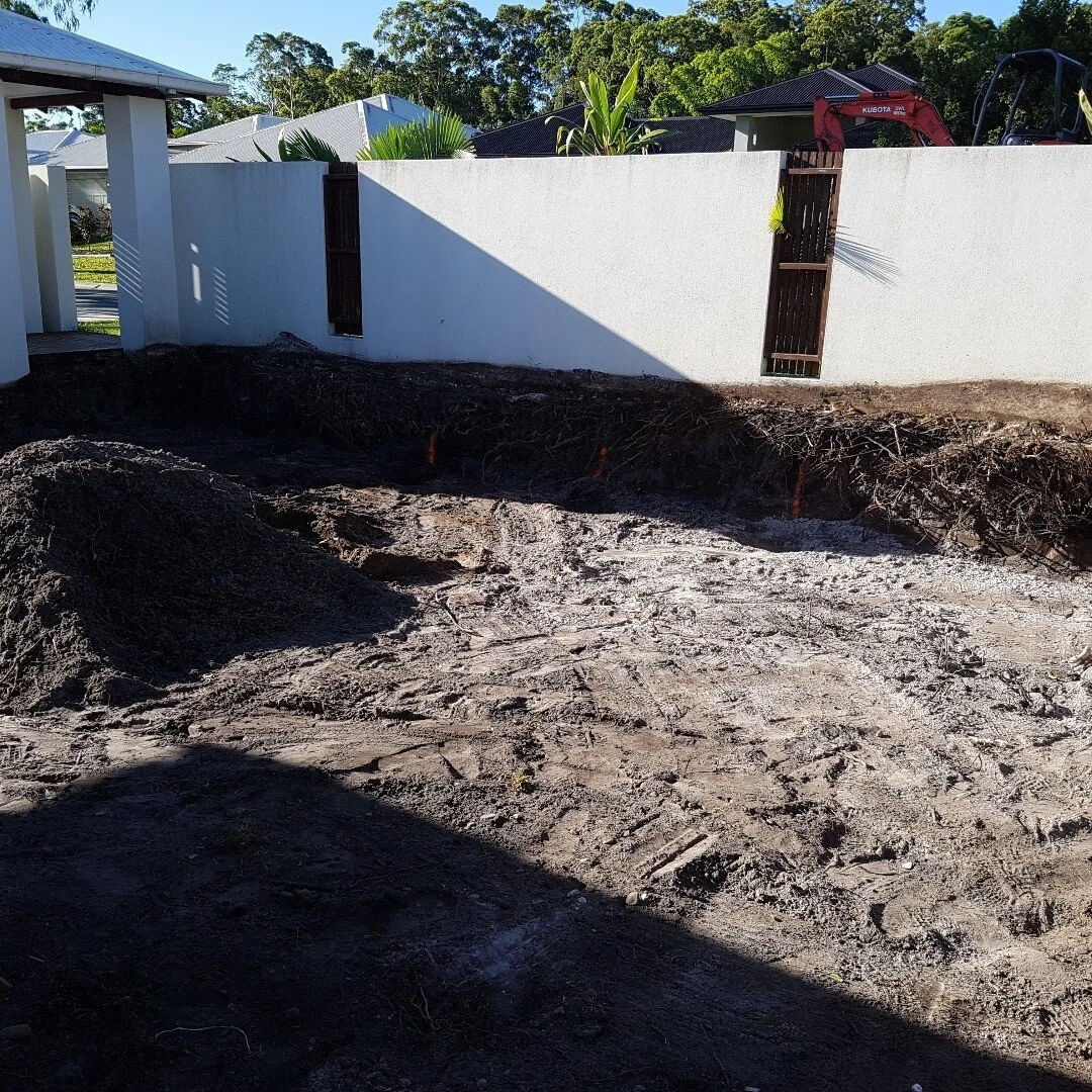 Reshape of a clients front yard for a new retaining wall and a new look.