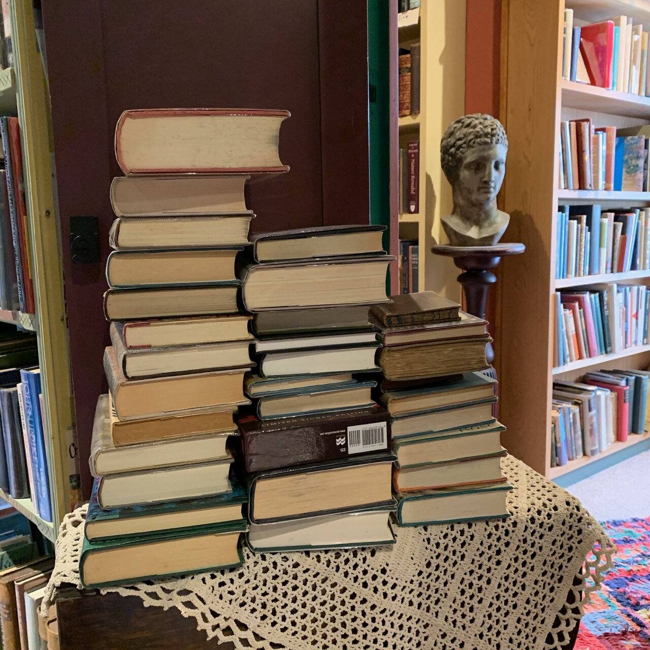 Books stacked for shelving.jpg