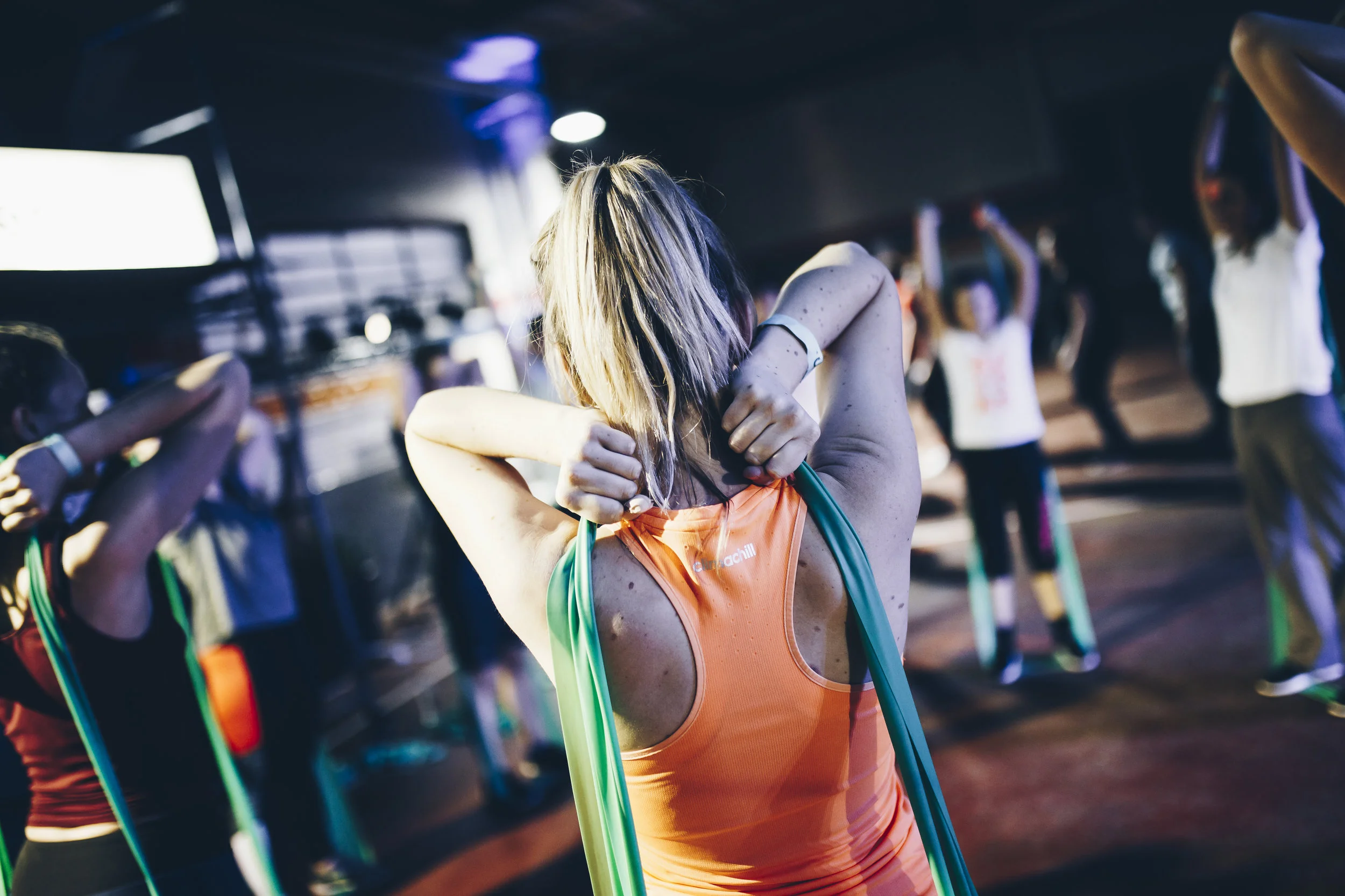 stock-photo-group-of-diverse-people-in-a-receding-line-doing-pilates-in-a-gym-balancing-over-the-gym-balls-with-244733887.jpg