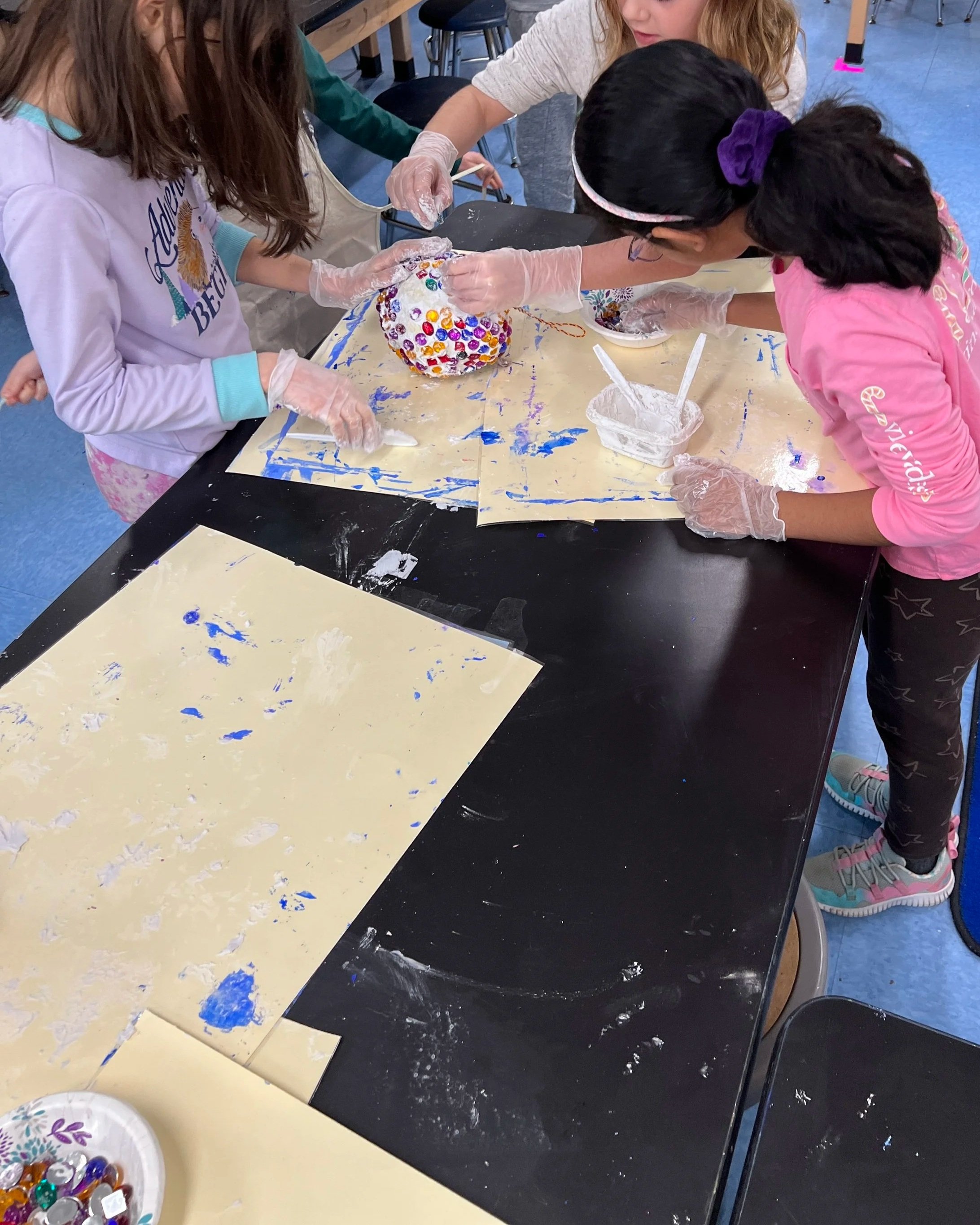 Elementary School children created the colorful balls in Mrs. Piwinski's art class.