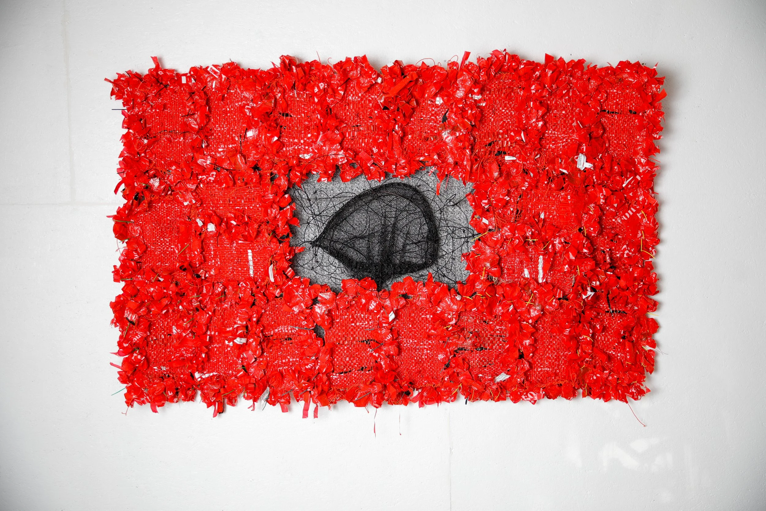 Storm, Warning!, 2026, plastic parking meter bags, erosion mat, net, line