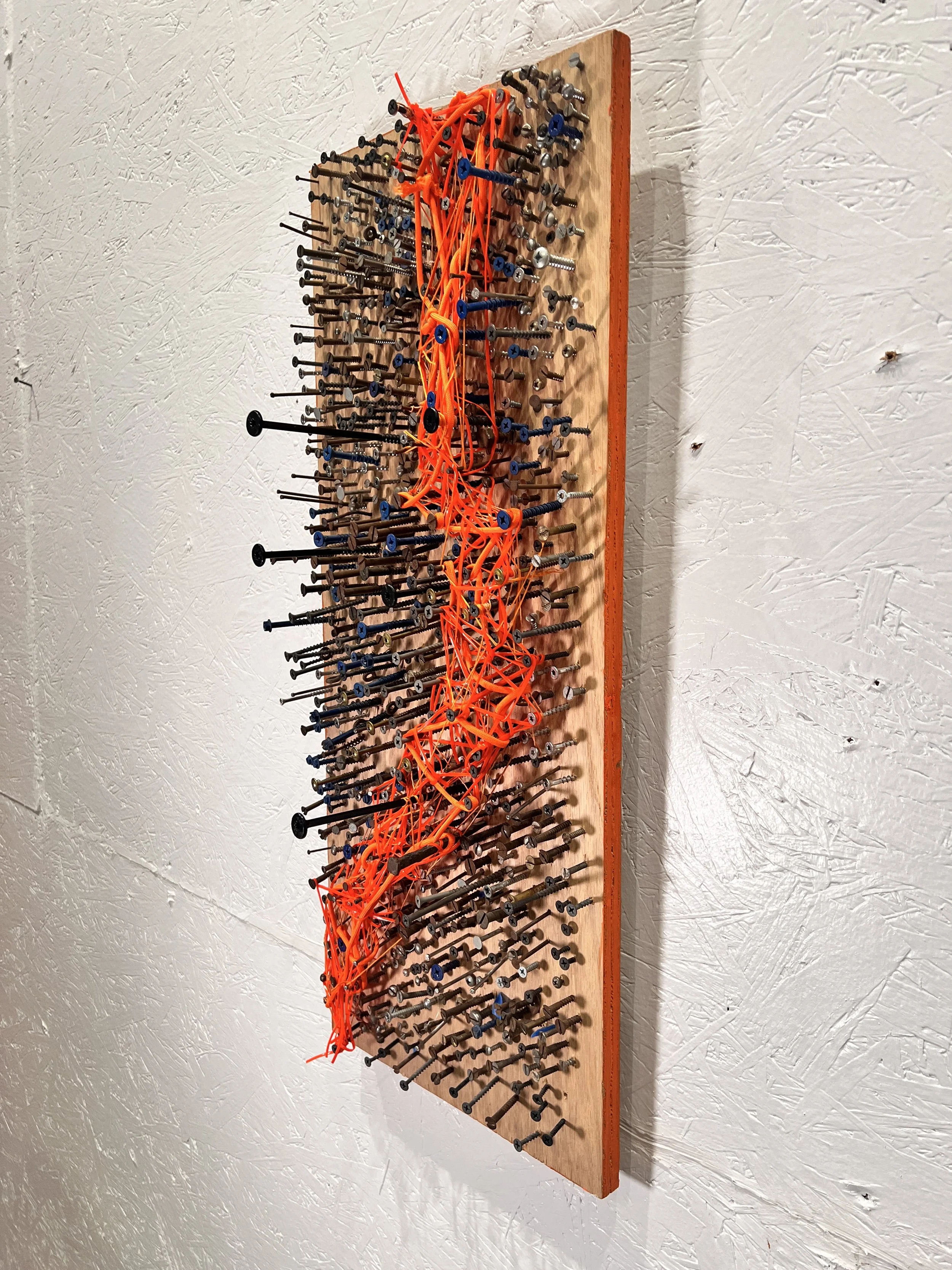 "After the El", 1,000 screws on board, orange thread and plastic