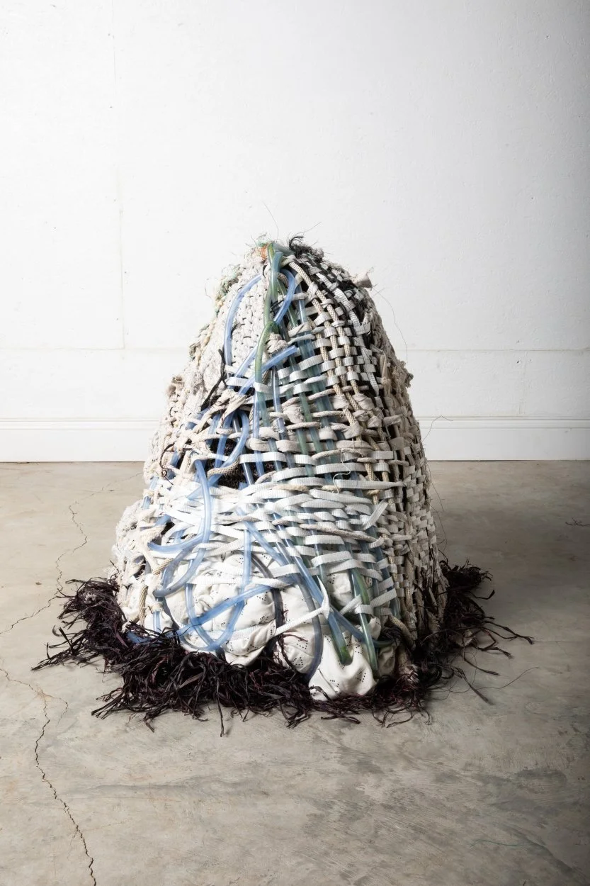 "ShoalWaters", collected ocean debris, repurposed painter's tarp, maple sugar hose, and lamp frame