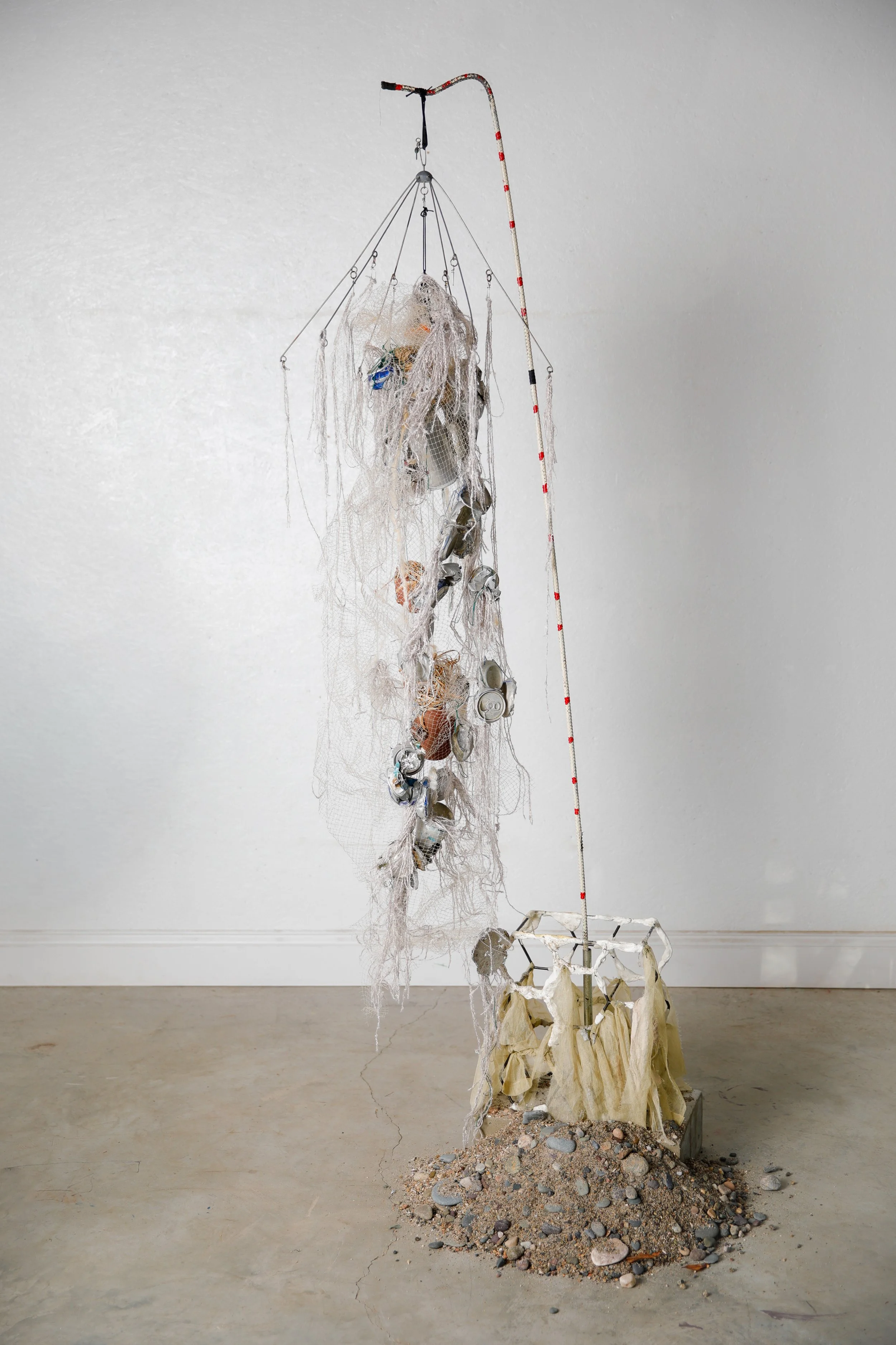 Carry Full Sail, 2026, collected debris,wool, thread, sea worn bricks, reed, sand, cement, 