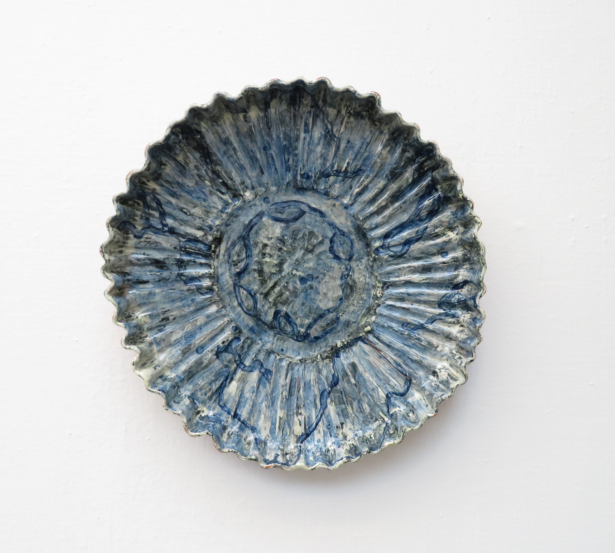   Deep blue ornamental plate I, 2018  | Earthenware clay with slip decoration.   Photo credit: Courtesy of Galleri Format Oslo 