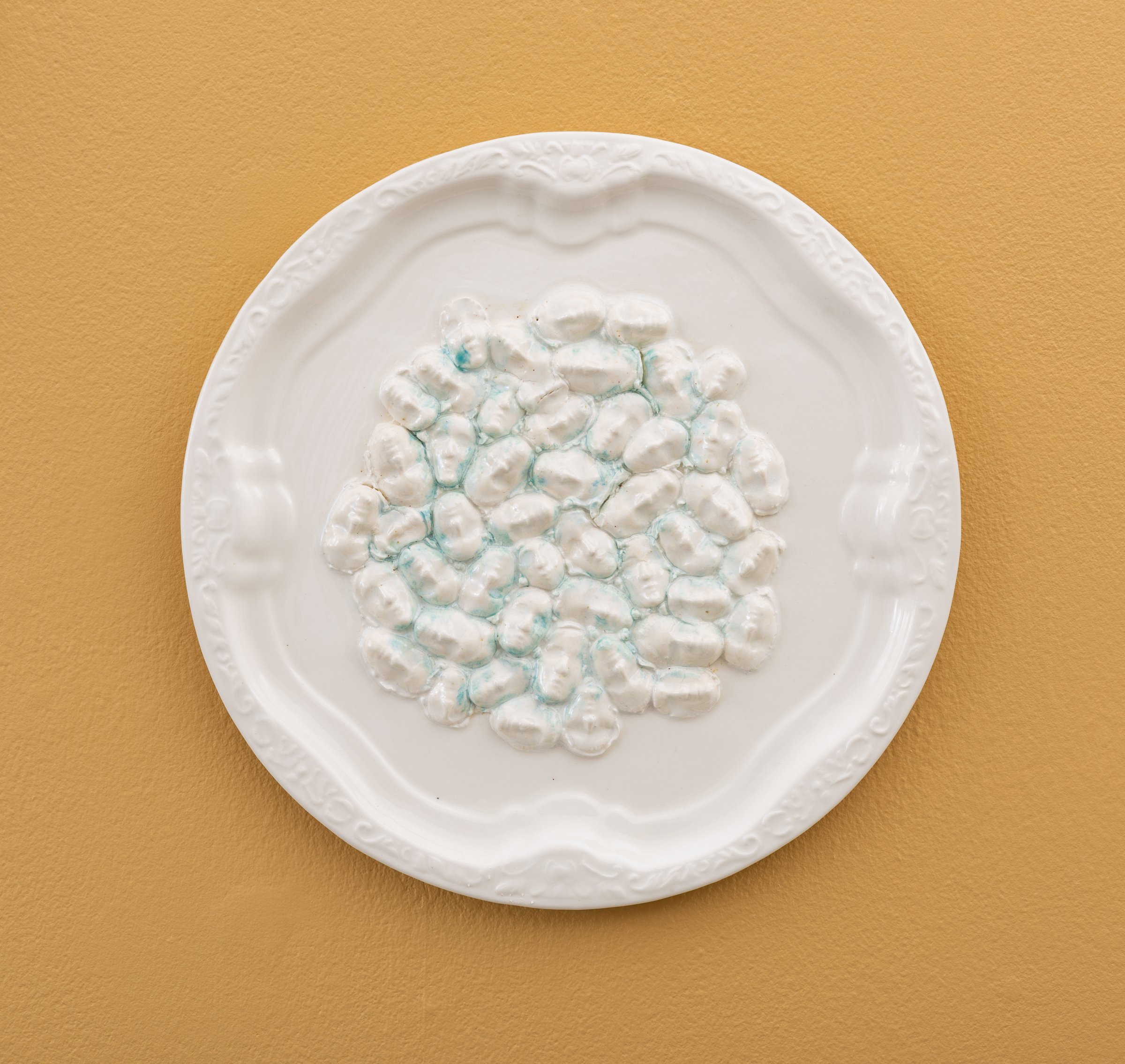  Why do Europeans put plates on their walls? XVIII | 2022  Porcelain, glazes, porcelain decals and tissue paper, press molding. 27x27x2cm  Photo: Thomas Tveter 