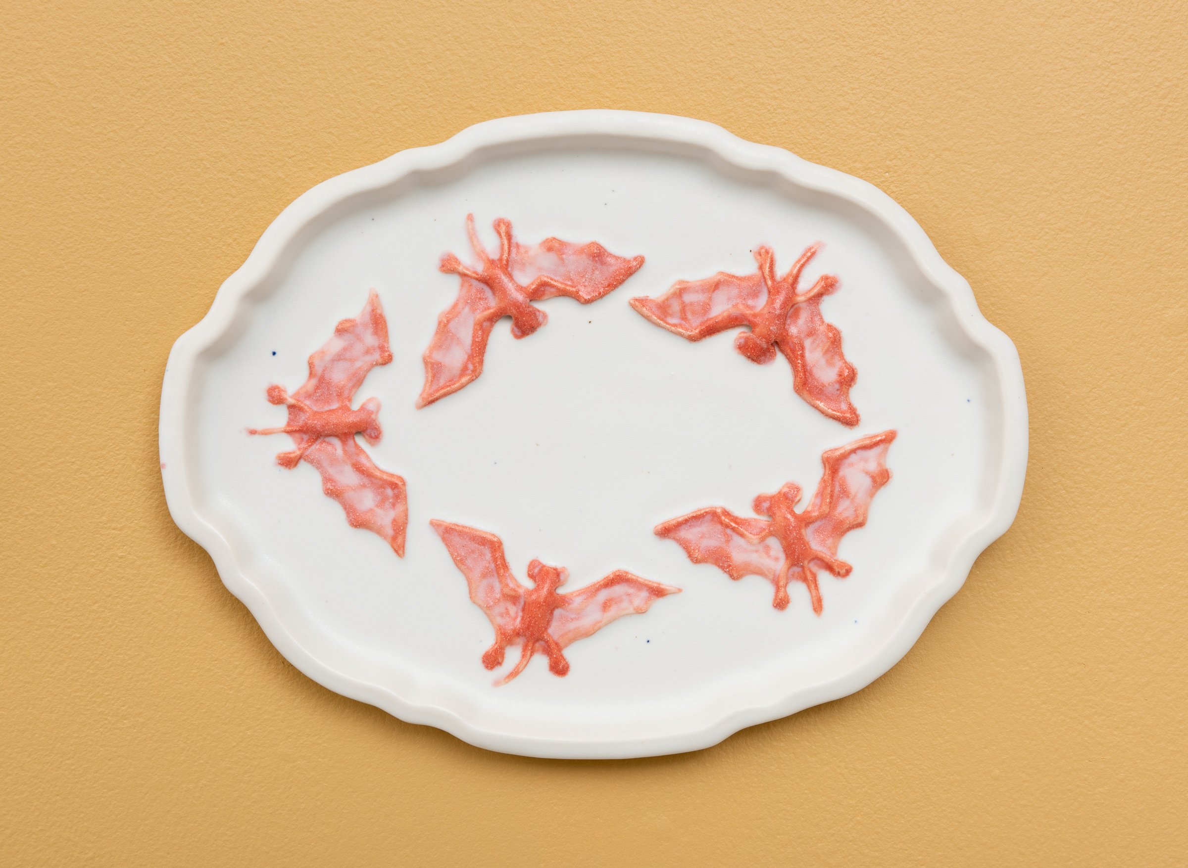  Why do Europeans put plates on their walls? III | 2022  Porcelain, glazes, porcelain decals and tissue paper, press molding. 39x30x3cm  Photo: Thomas Tveter 
