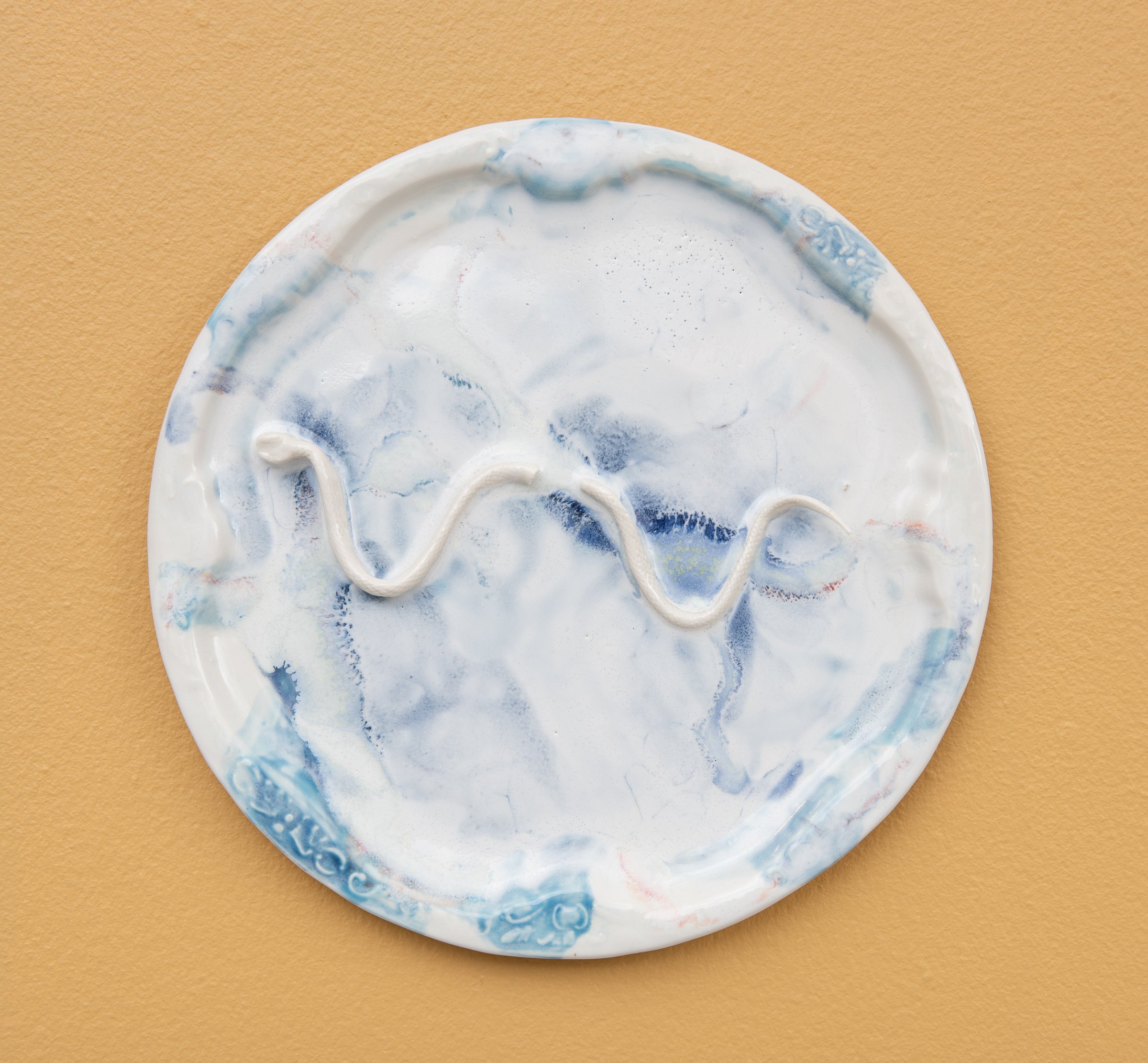  Why do Europeans put plates on their walls? X | 2022  Porcelain, glazes, porcelain decals and tissue paper, press molding. 27x27x3cm  Photo: Thomas Tveter 