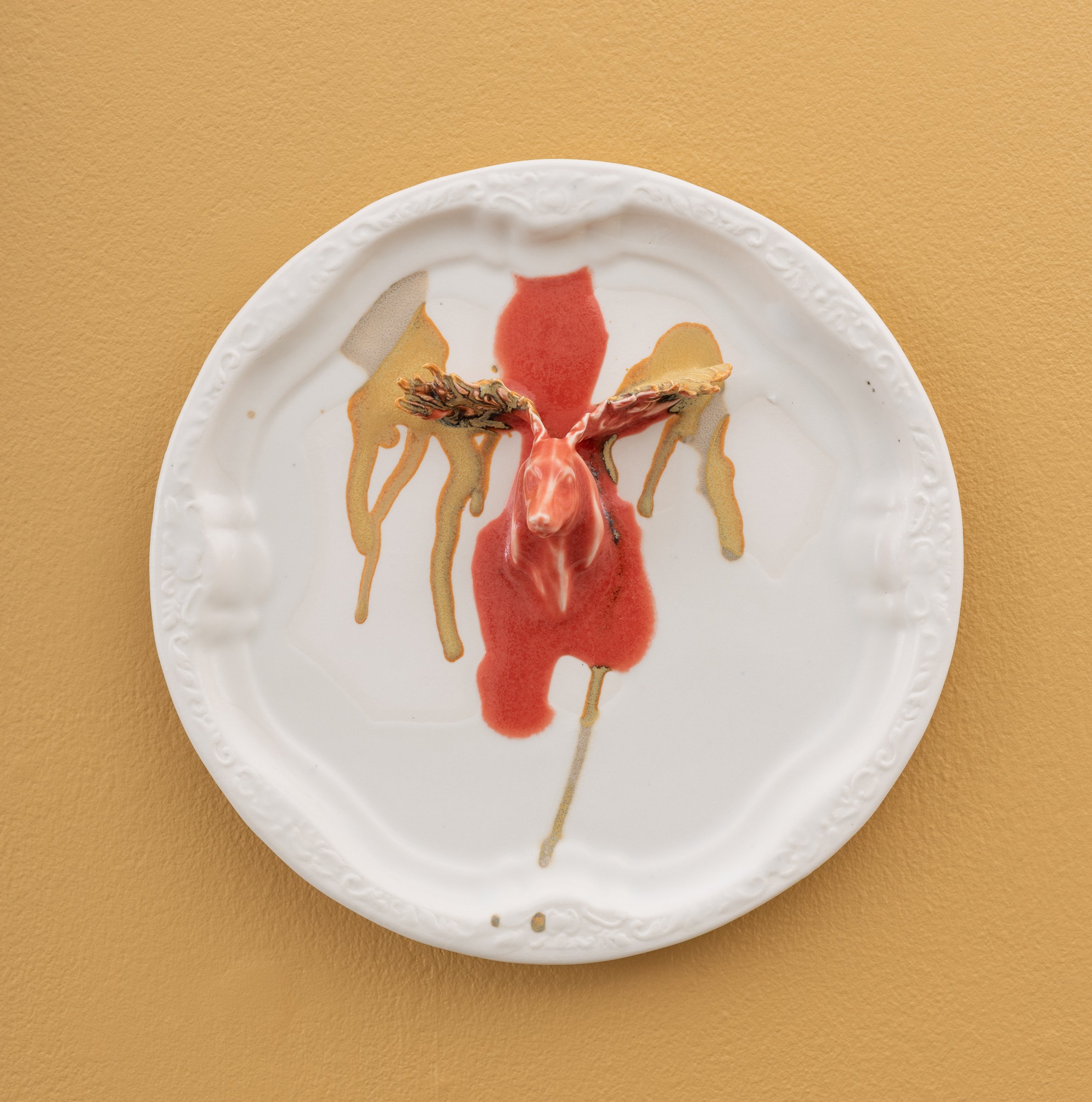  Why do Europeans put plates on their walls? XII | 2022  Porcelain, glazes, porcelain decals and tissue paper, press molding. 27x27x4cm  Photo: Thomas Tveter 