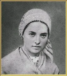 Image Description: Young Woman in robe and headscarf looking seriously toward the camera (black and white photo),