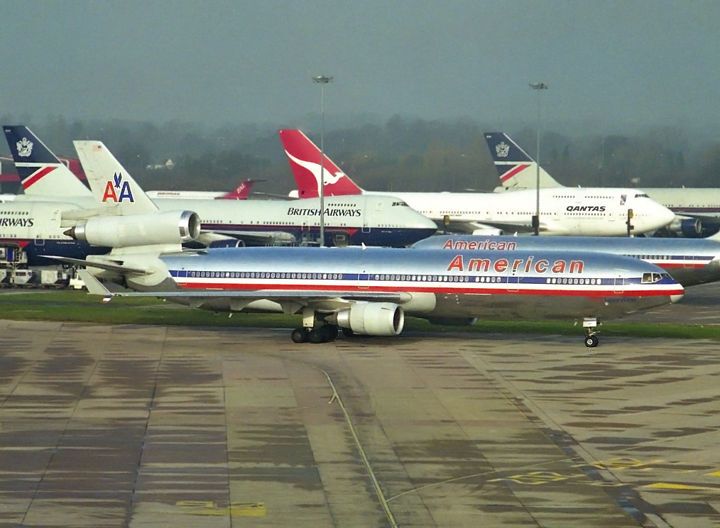 A great shot from Stuart Prince which really does capture a moment in time at MAN.Packing those diversions in, B747’s,American Airlines and even a BAC 1-11 creeping in on the photo! The main subject is of course the MD11 N1763 but whats taking place in the back ground is just as interesting…17th March 1999.Super shot from the T1 Multi Story…oh dear 20 years ago!