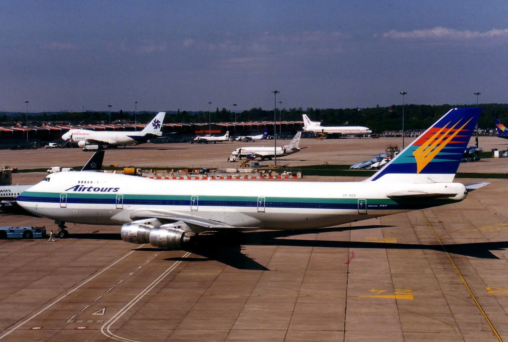 Airtours operated Air New Zealand B747-200 ZK-NZZ on flights from Manchester.Captured by Denis Norman from the T1 Multi Story Car Park on 2nd May 1998.