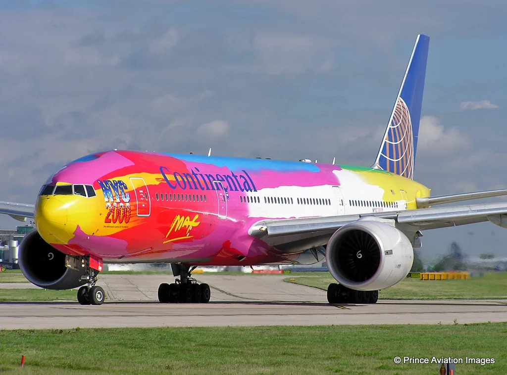 Continental’s very colourful B777-200 N77014 NYC2000 Livery (by Peter Max) was a popular sight for some at MAN in May 2004. Photo: Stuart Prince.