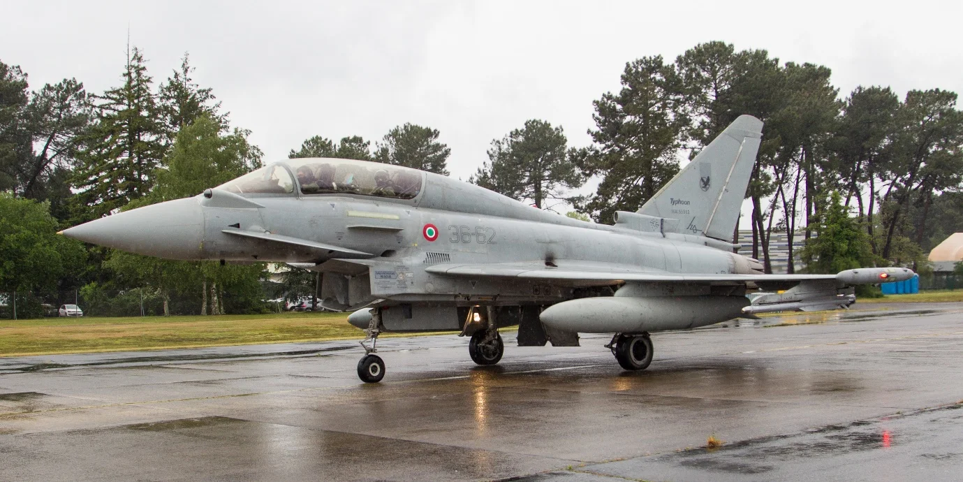Photo: Italian Air Force Typhoon serial MM55902 taxiing out at a very wet MDM. Debbie Riley