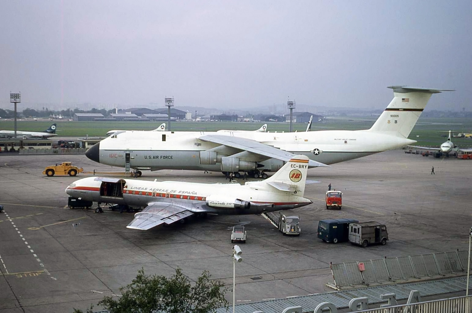 Paris Le Bourget - September 1971 and an Iberia Caravelle is dwarfed by a mighty USAF C5 Galaxy. What else can we see? A number of Caravelles,Daks, a Cyprus ? Trident and a UTA Dc8.. This was my favourite airport as it always had a few surprises in store