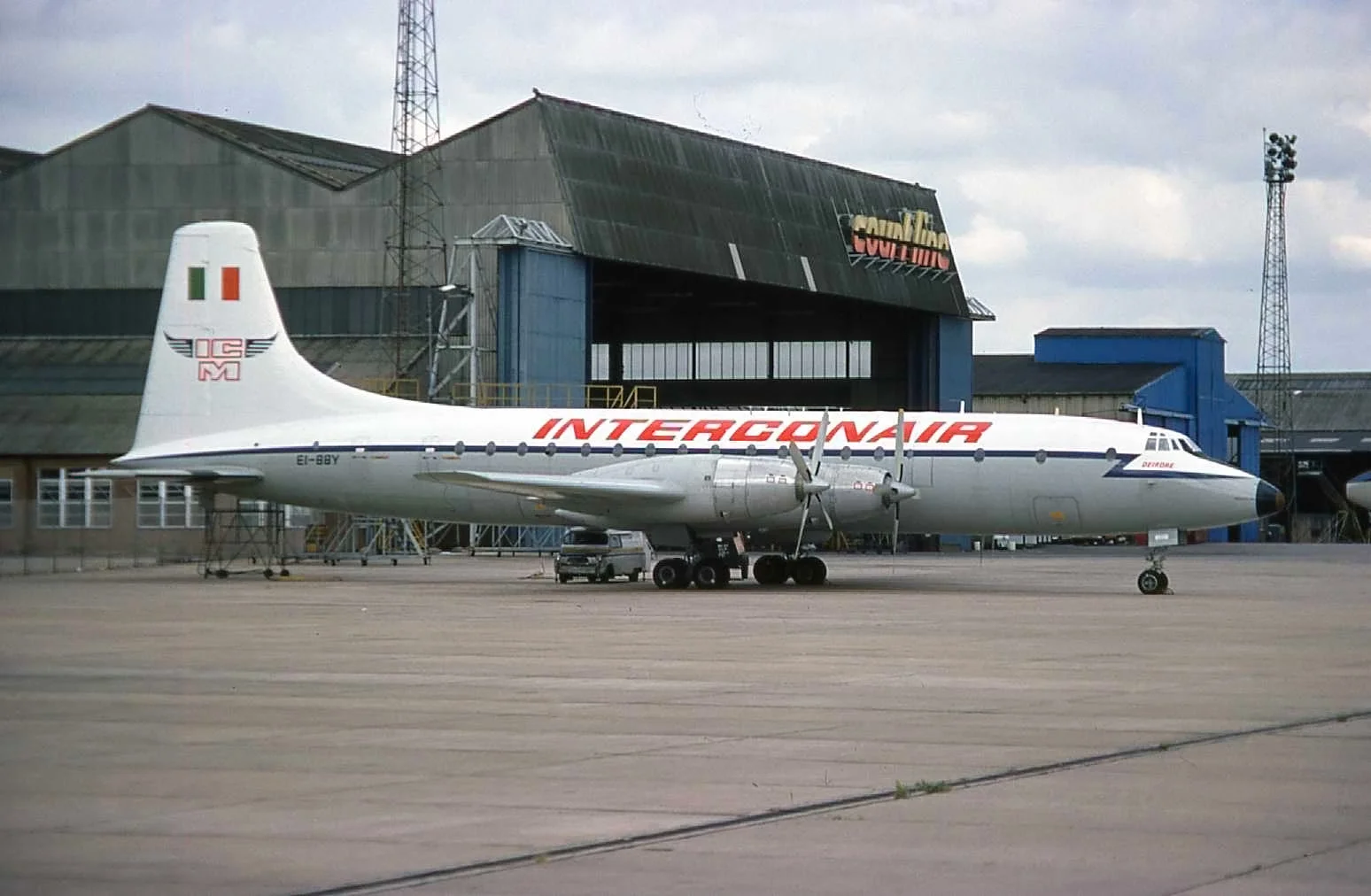 The famous Court line hangar and an Interconair (Ex RAF) Britannia EI-BBY parked outside . Luton Airport August 1976. On a visit to Luton only last week (August 2019) I was recalling seeing Cubana Britannias in this very same spot and driving down from MAN to catch a glimpse of the rare beasts! A quick check with the Security Guard on the gate…“Any chance of a quick walk on the ramp for a picture of the Brit?” …Sure no problem! In fact our early coach trips got permission for a drive around the ramp at o’dark thirty in the morning.Oh yes those foggy cold Winter mornings at Luton. I remember them well..