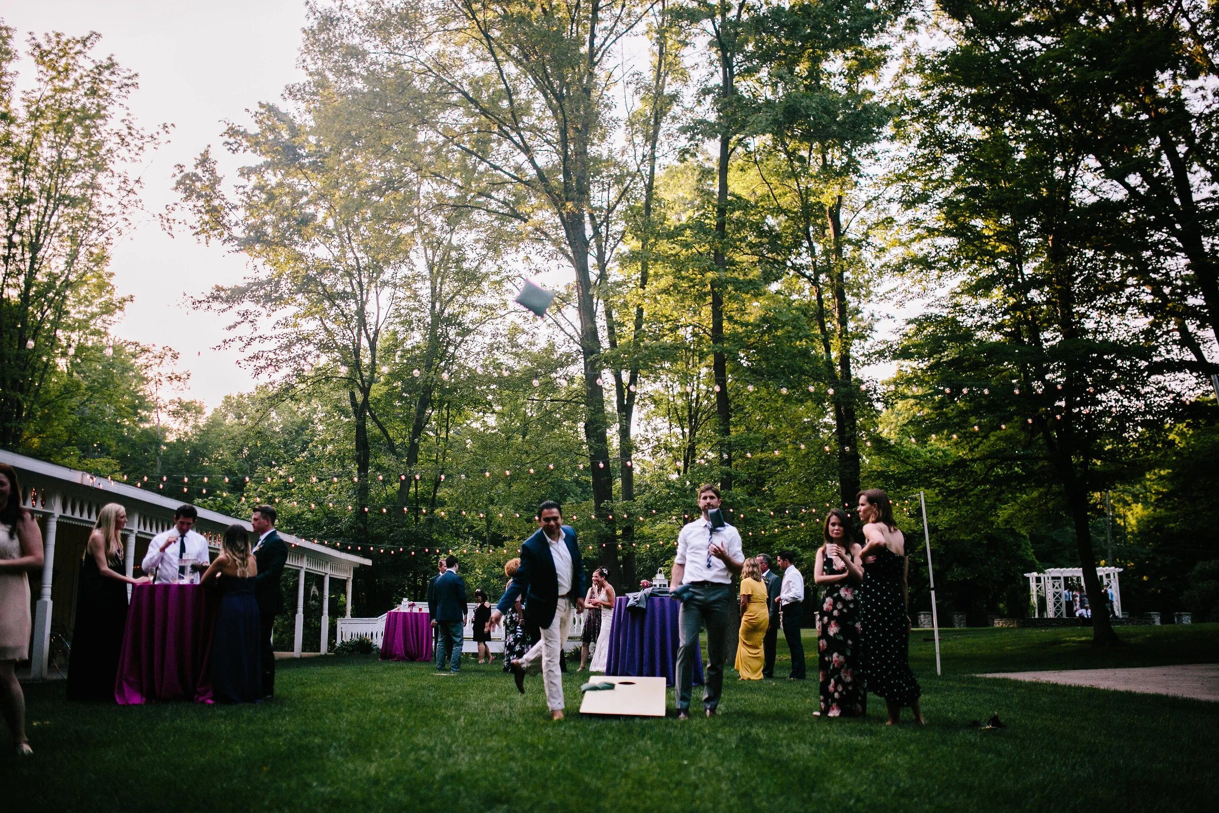 Competitive games of cornhole outside