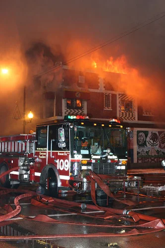Engine 109 with hoses surrounding truck