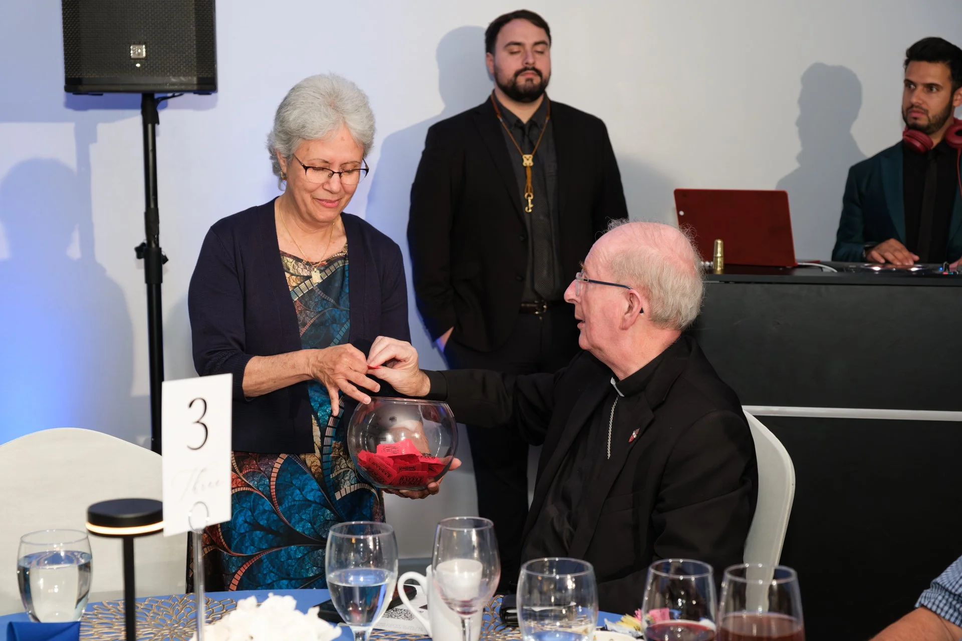 Elsa asking Bishop Noonan to draw winning Raffle Ticket.jpg