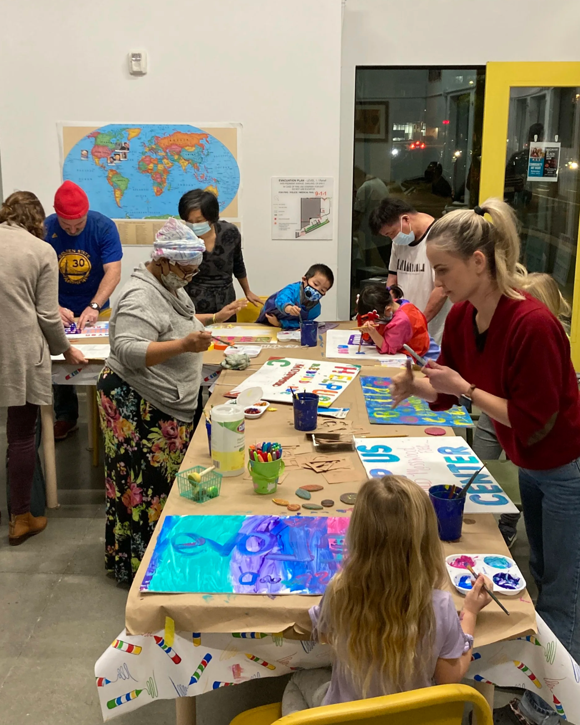 Yard sign painting gather to help raise funds to build a new Rec Center at neighborhing Mosswood Park.