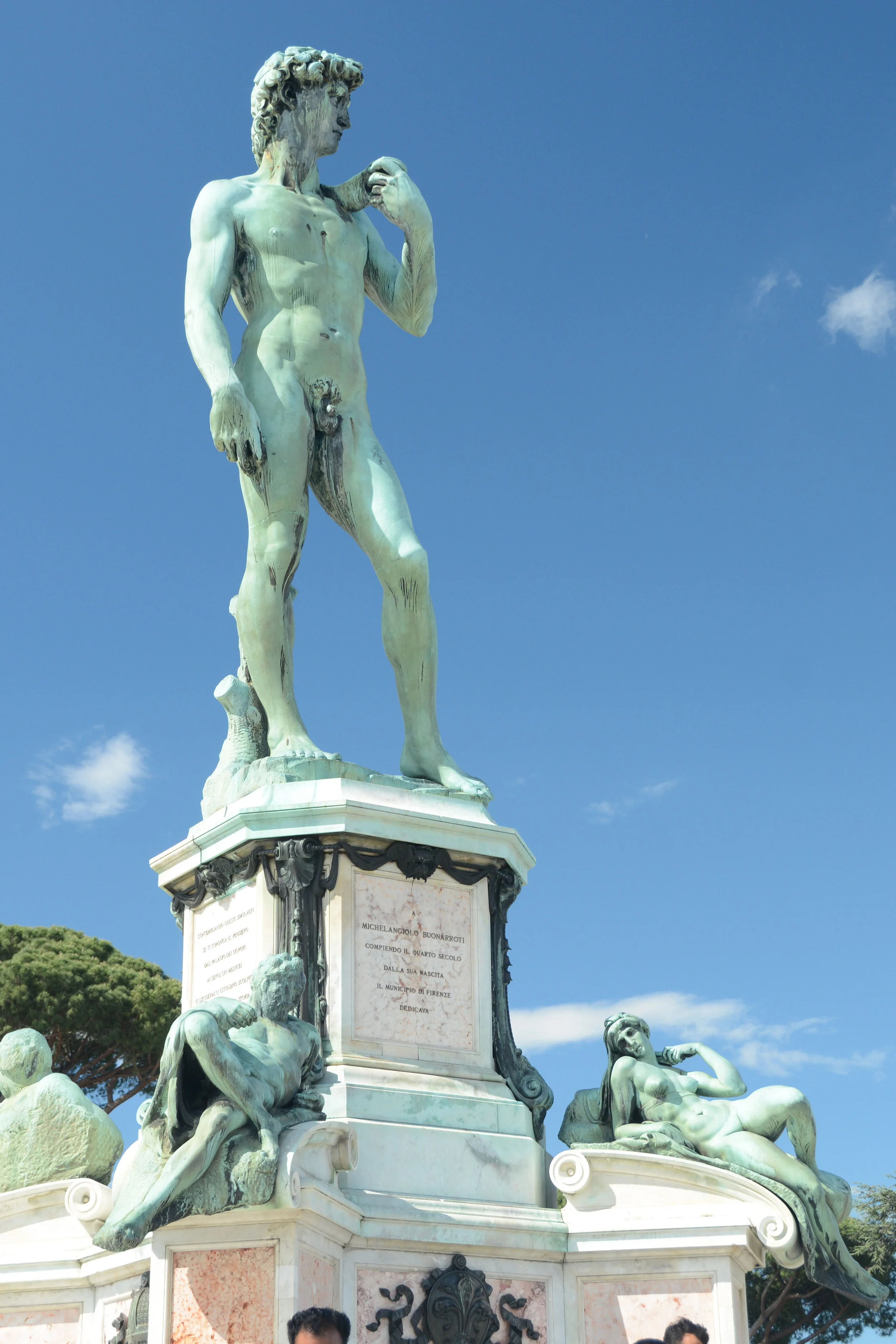 Replica of David with some lounging ladies in Michelangelo Square where the tour buses gather.