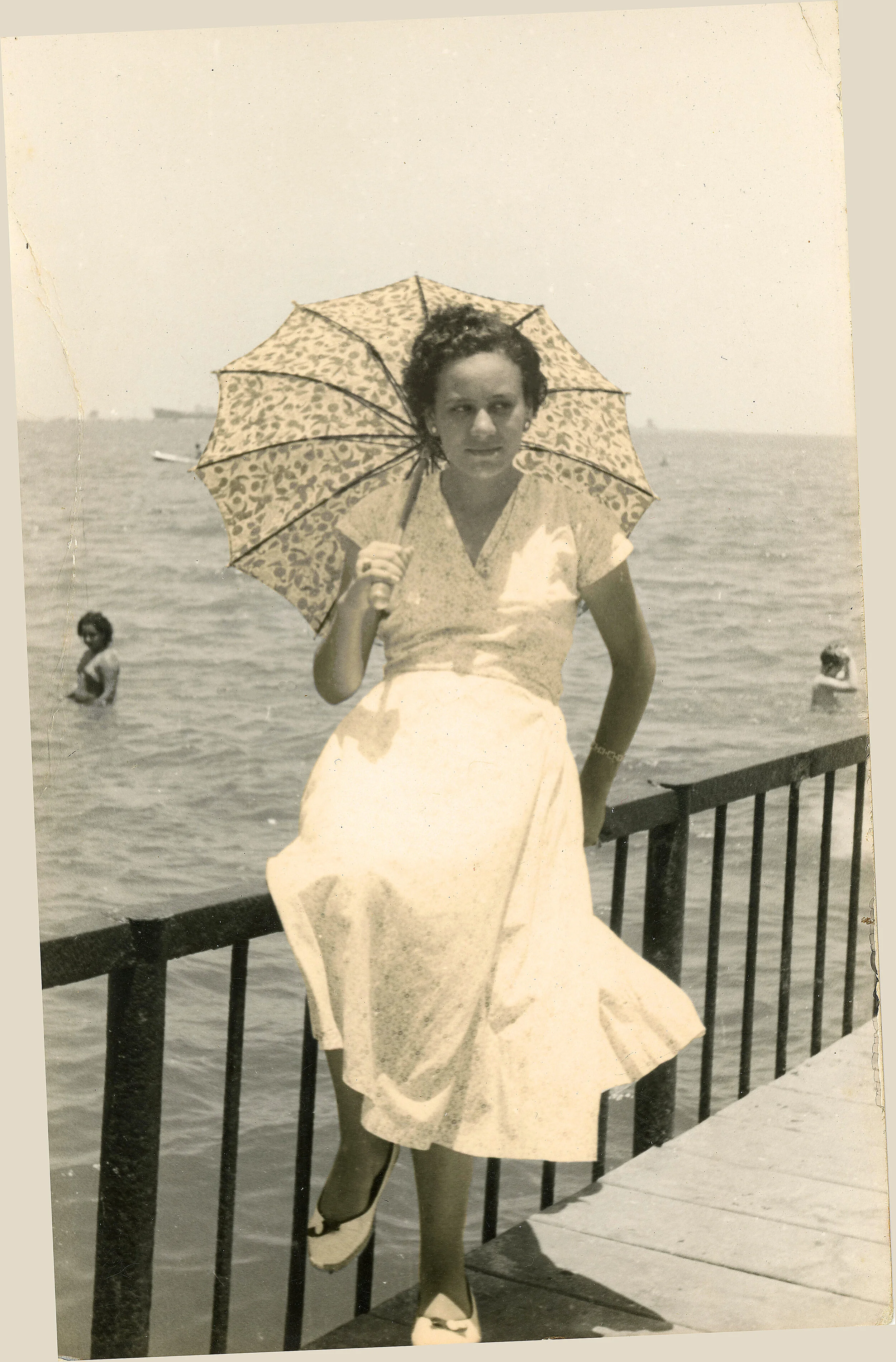Dawlat as a young woman posed by the sea.