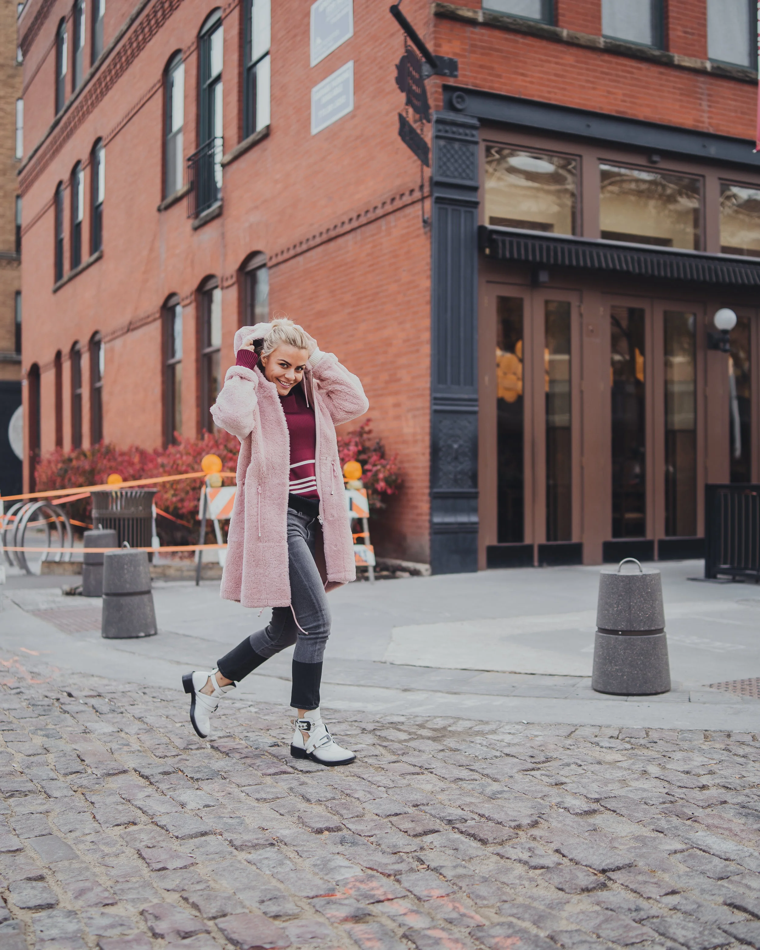 Monika Dixon of Monika Dixon Public Relations is wearing Frame jeans paired with a Calvin Klein sweater, Anne Vest jacket and Balenciaga boots.
