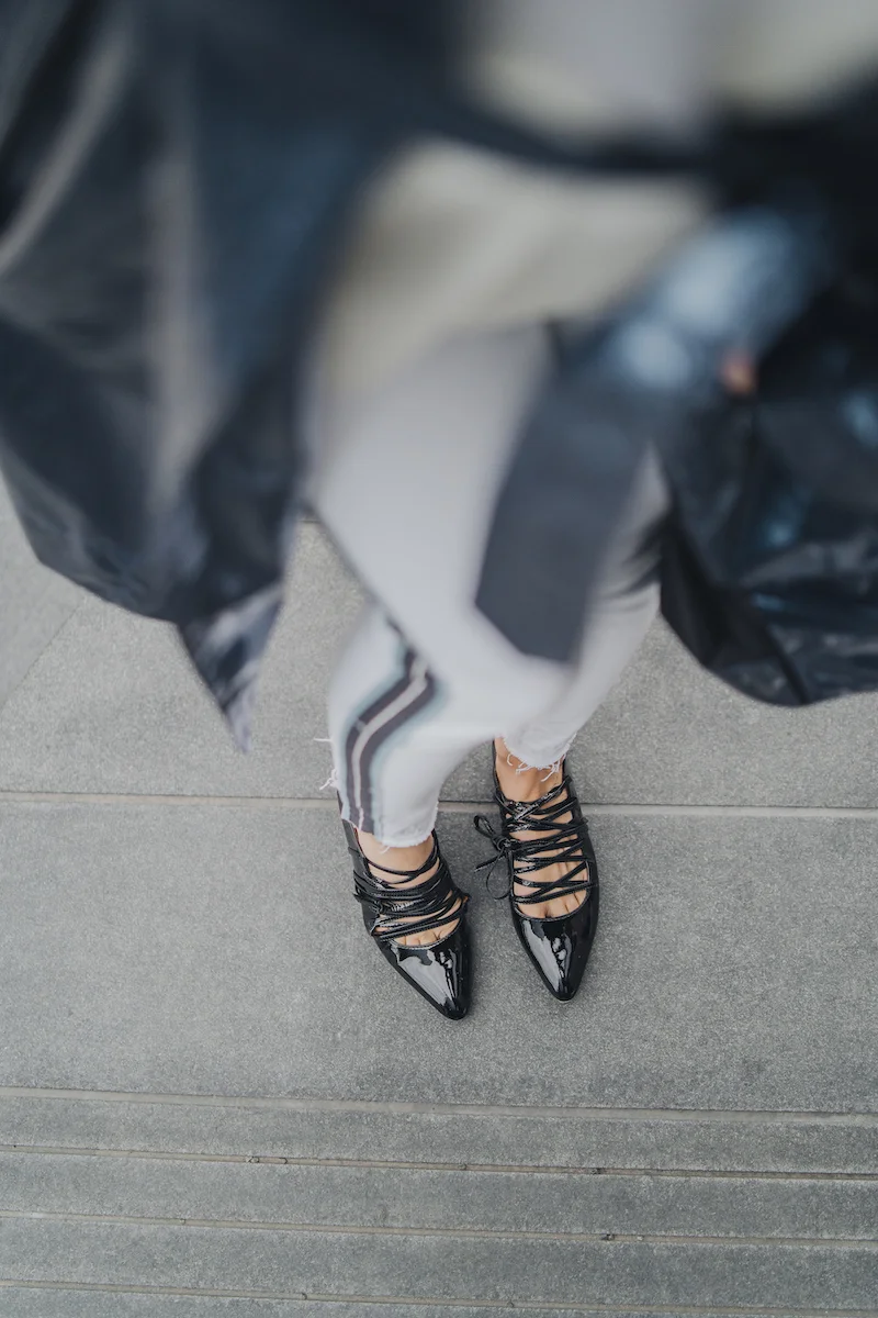Monika Dixon of Monika Dixon Public Relations is wearing Grlfrnd jeans paired with a white Helmut Lang blazer and Marc Jacobs trench coat.