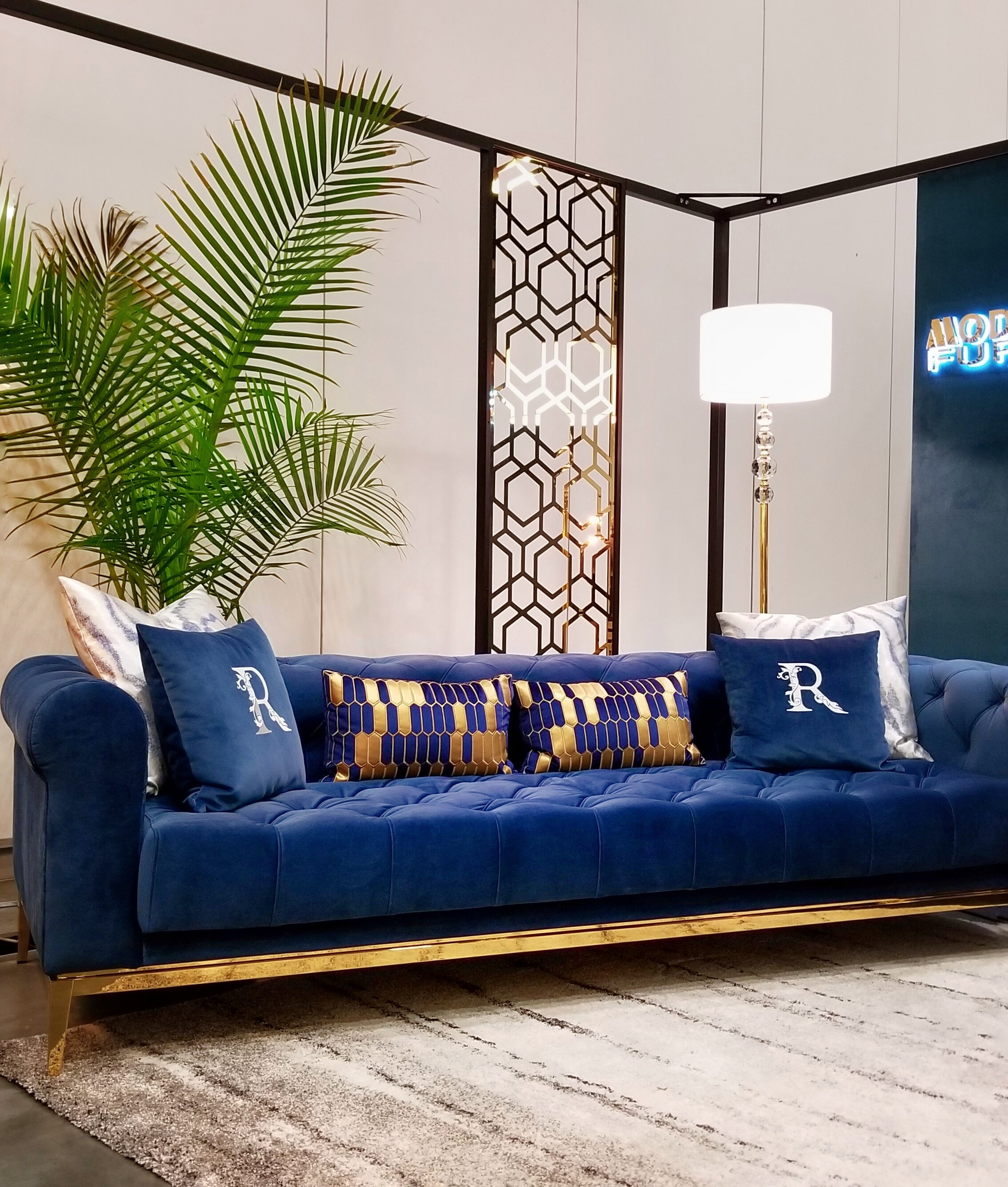 interior-designs-by-adrienne-cranbrook-bc-indigo-blue-sofa-blue-gold-pillows-floor-lamp-button-tufted