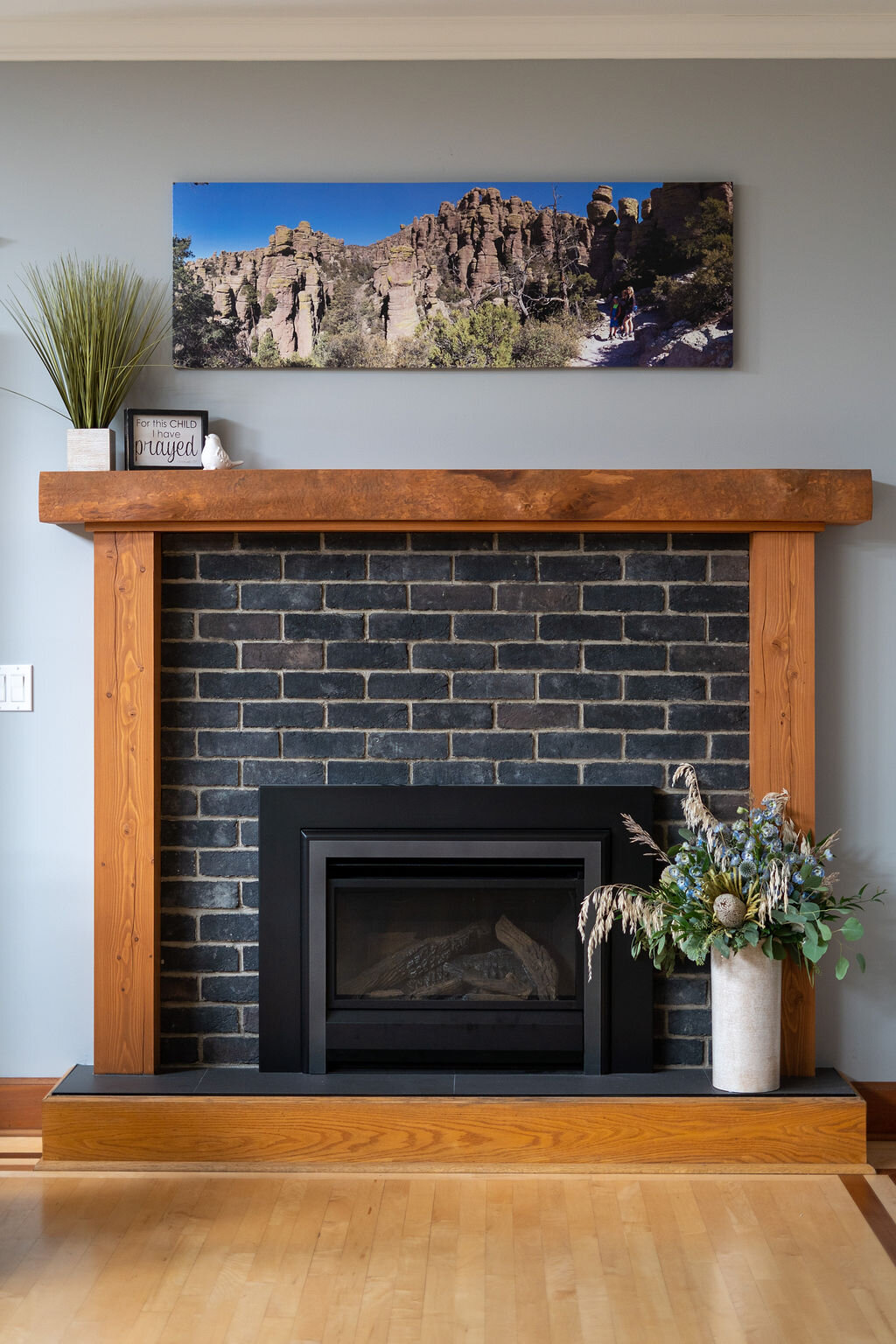 interior-designs-by-adrienne-cranbrook-bc-gas-fireplace-brick-veneer-eldorado-stone-fir-mantle