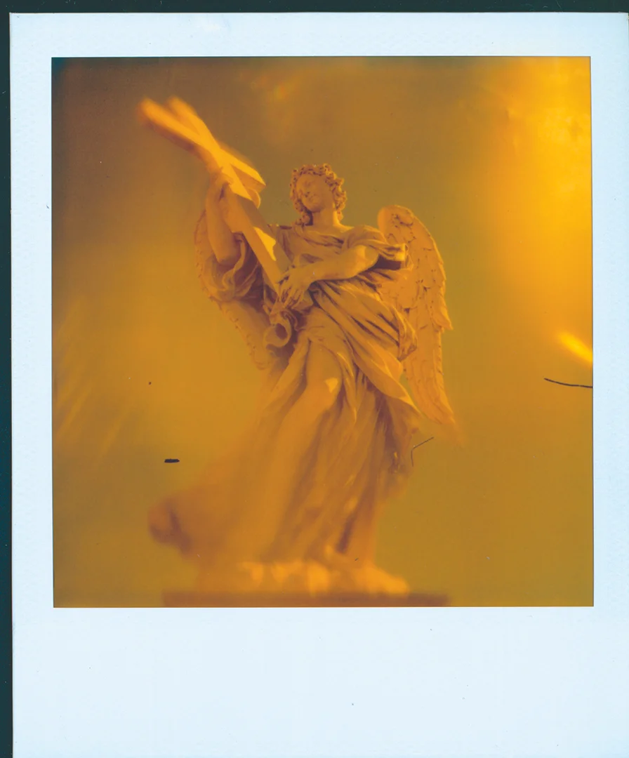 Title: ROMAN ANGEL This is a great angel statue on Ponte Vecchio in Rome, Italy that I shot with an old SX-70 Land Camera.