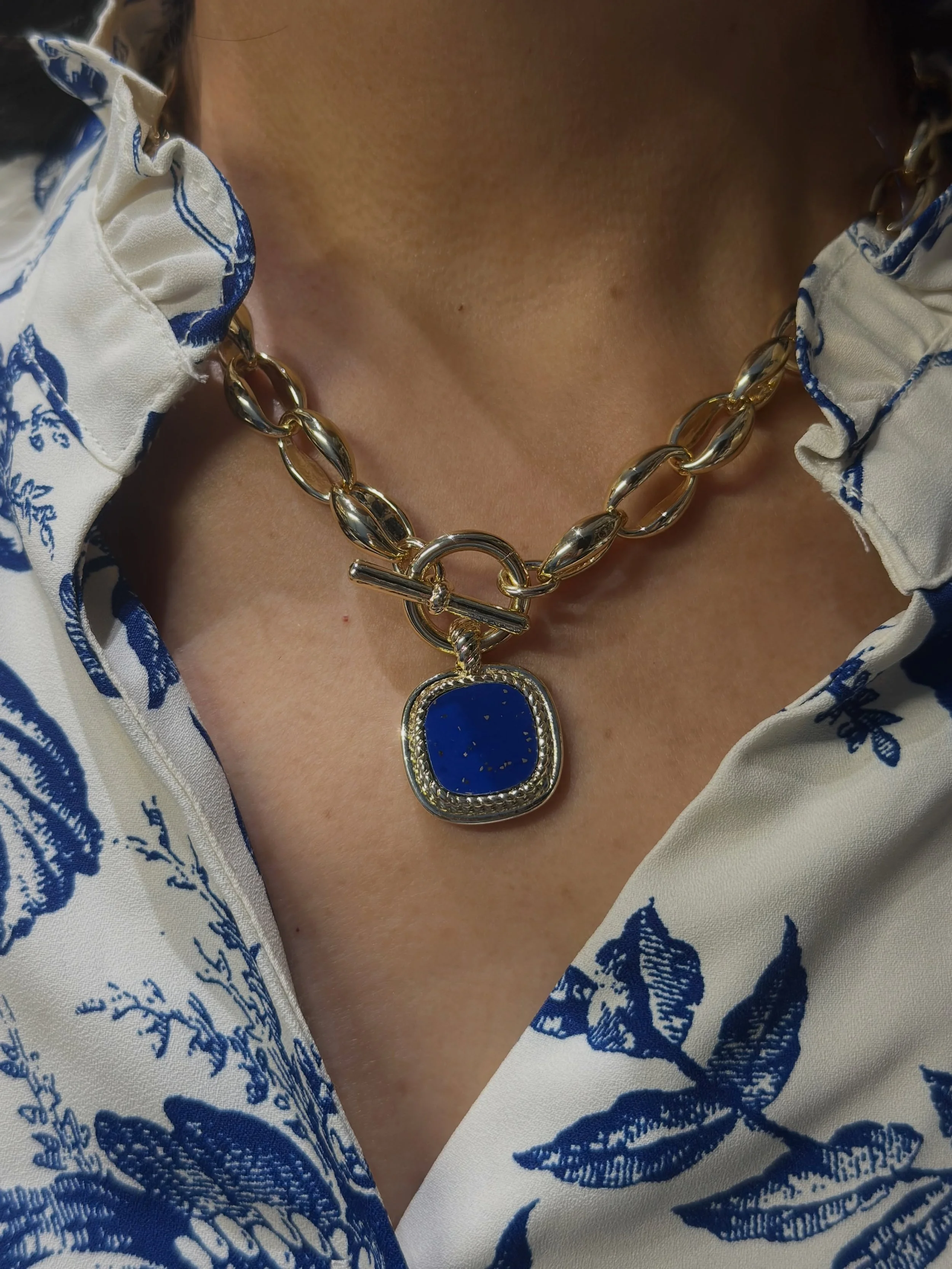 A little true blue. 💙

Bold sapphire tones, a classic chain, and a floral summer button-down. Sometimes one piece is all you need.