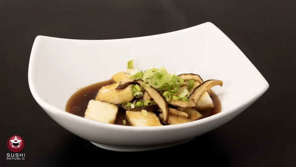 Golden tofu perfection 🍱 Crispy fried agedashi tofu soaked in our savory house sauce, topped with mushrooms and fresh scallions for the perfect bite. ✨🥢