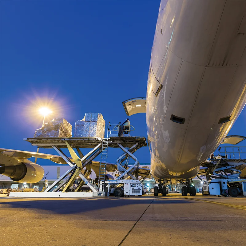 A plane being loaded with cargo