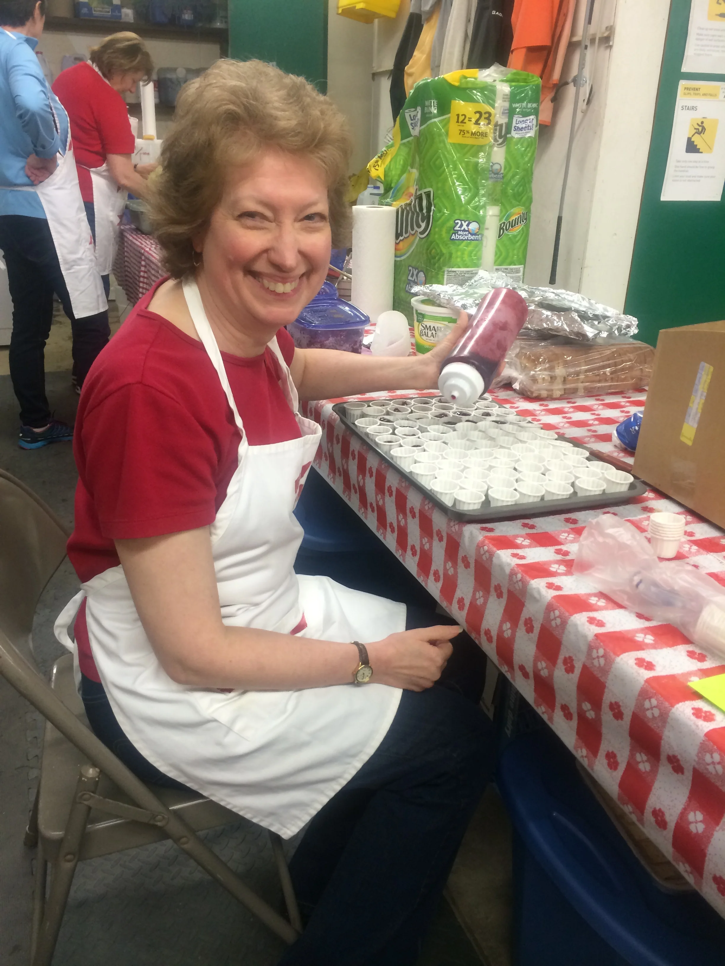 Society President Marie Jost prepares raspberry jam.