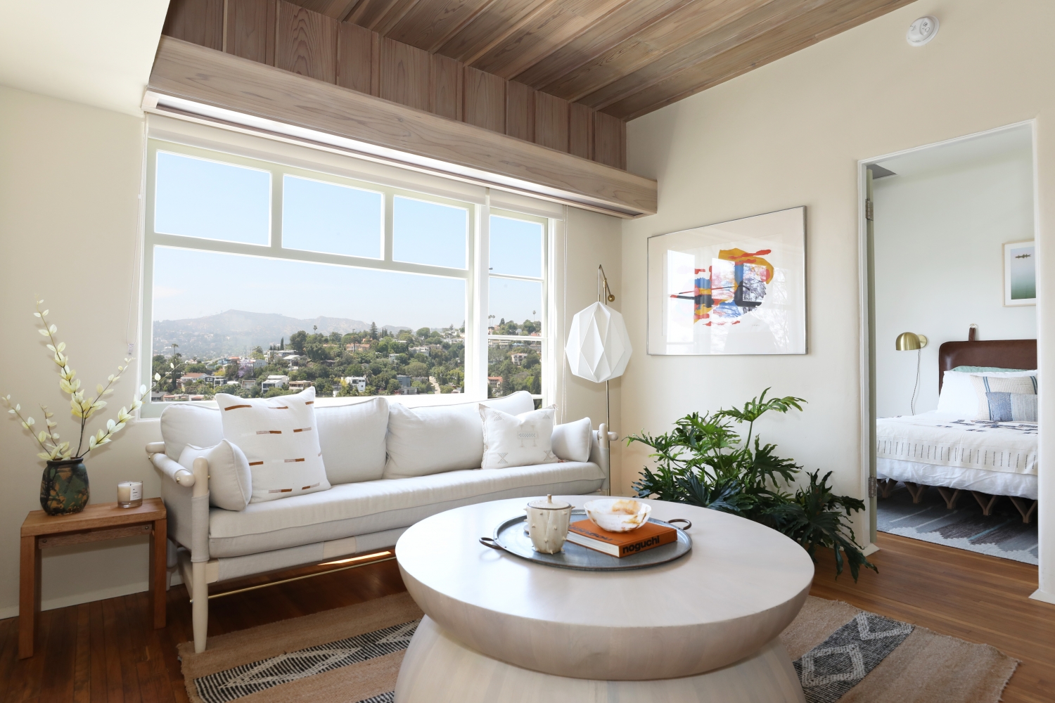 The living room and peek into the bedroom in the Maid's Room at Manola Court.