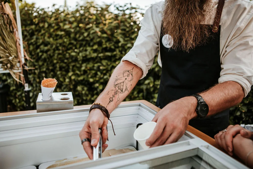 Staff member serving artisan gelato from The Gelato Bike at a wedding in NSW