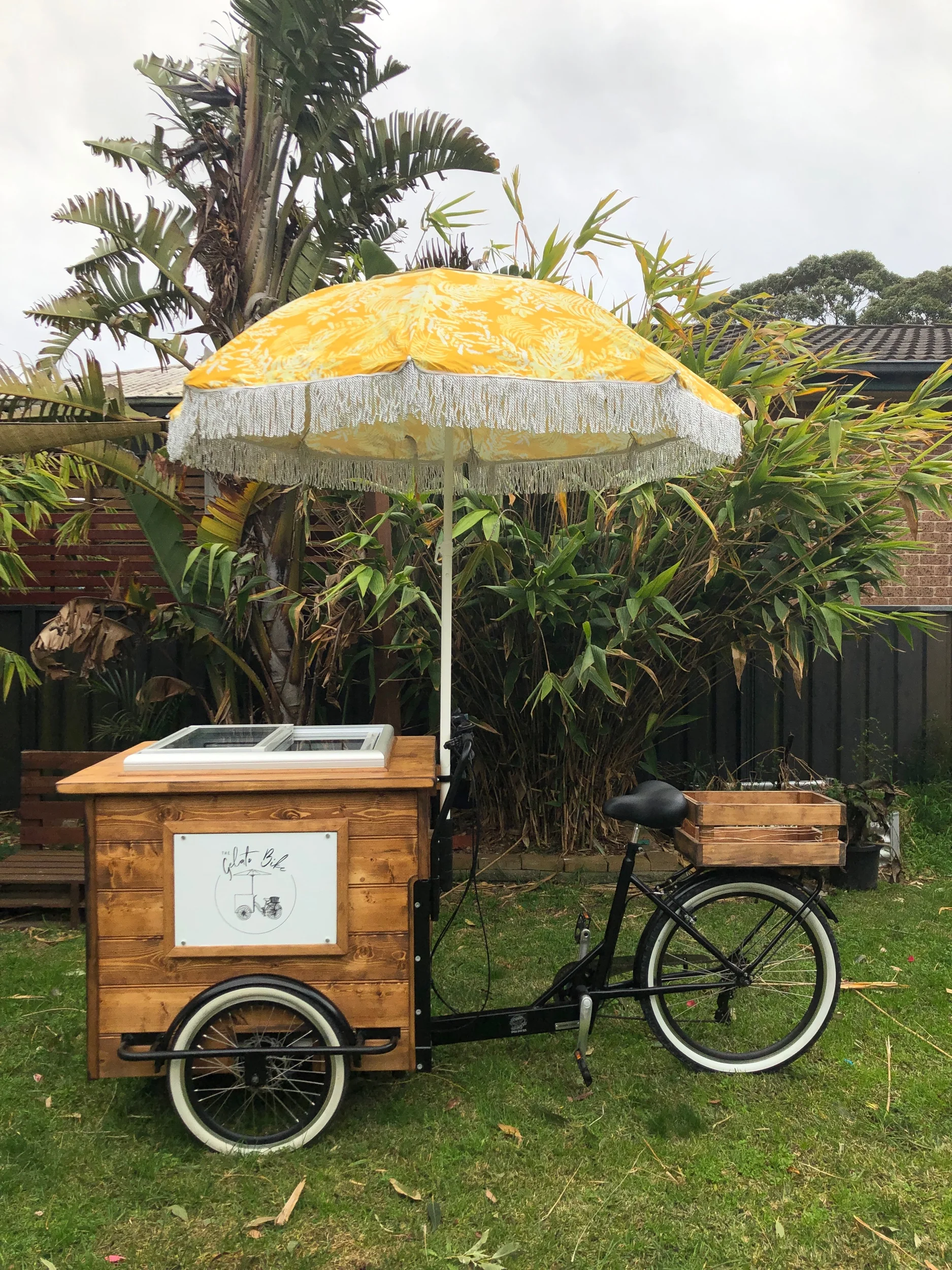 Timber gelato bike with yellow umbrella for colourful wedding and event styling