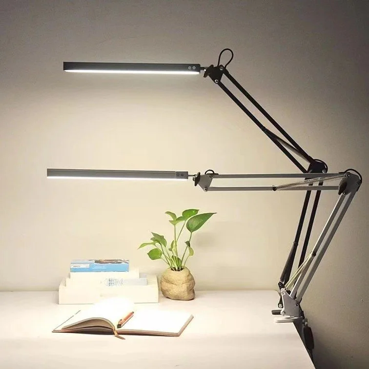Black and grey LED articulated arm desk lamps side by side on study desk, dimmable LED, daylight and neutral modes