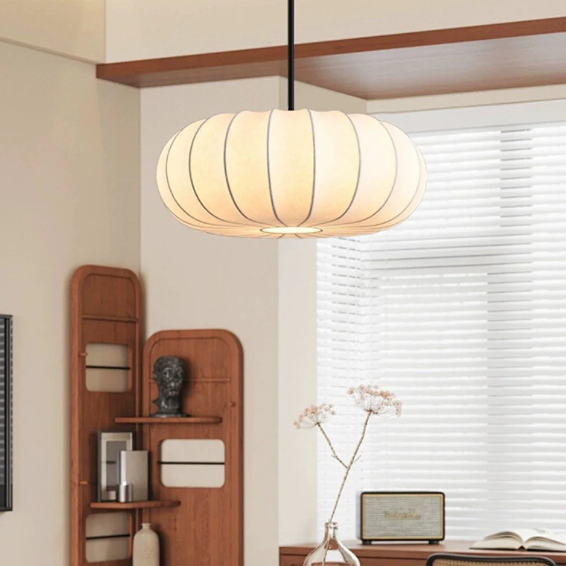Round ribbed wabi sabi pumpkin pendant lamp in minimalist HDB living room, warm lighting