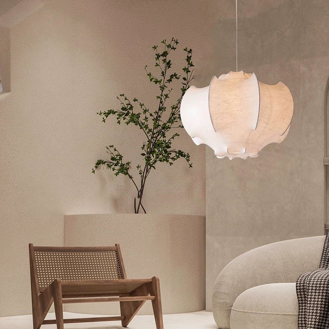 Wabi sabi bat pendant lamp glowing warmly over dining table in dark moody interior, Singapore home