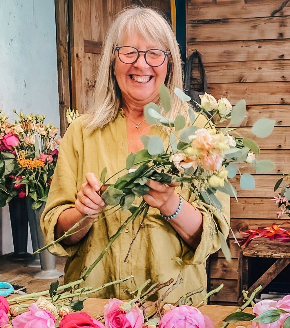 Sue creating floral arrangements for Arcade Flowers