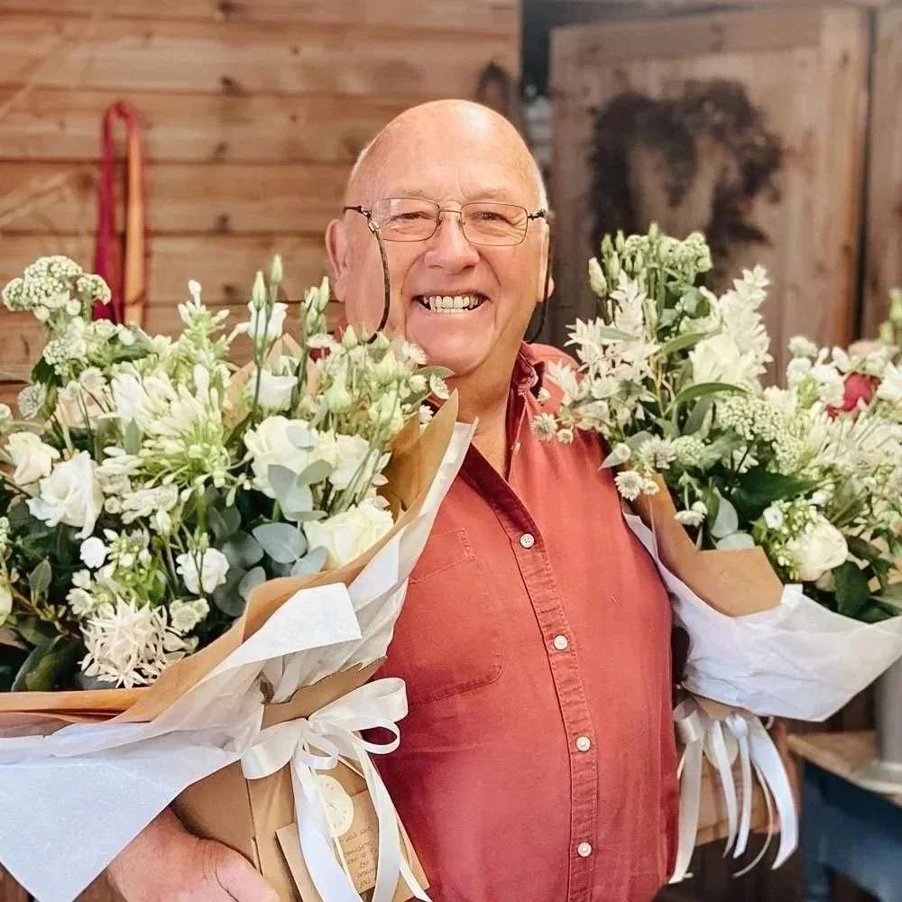 Loz delivering fresh flower bouquets for Arcade Flowers