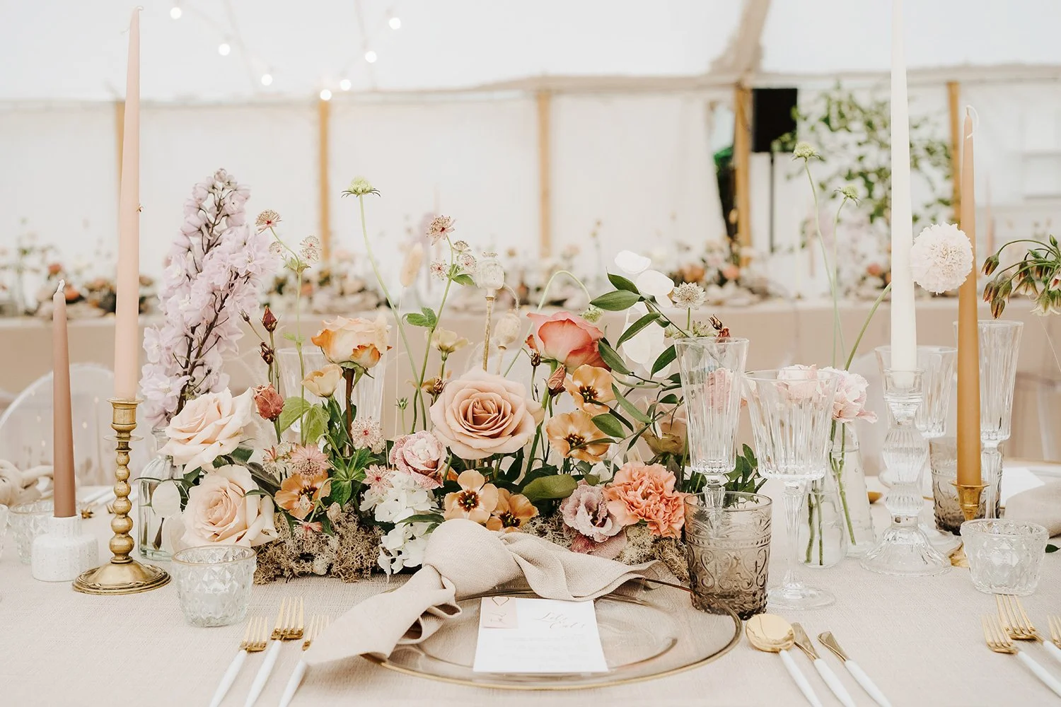 A wedding table decorated with a beautiful luxurious floral arrangement.
