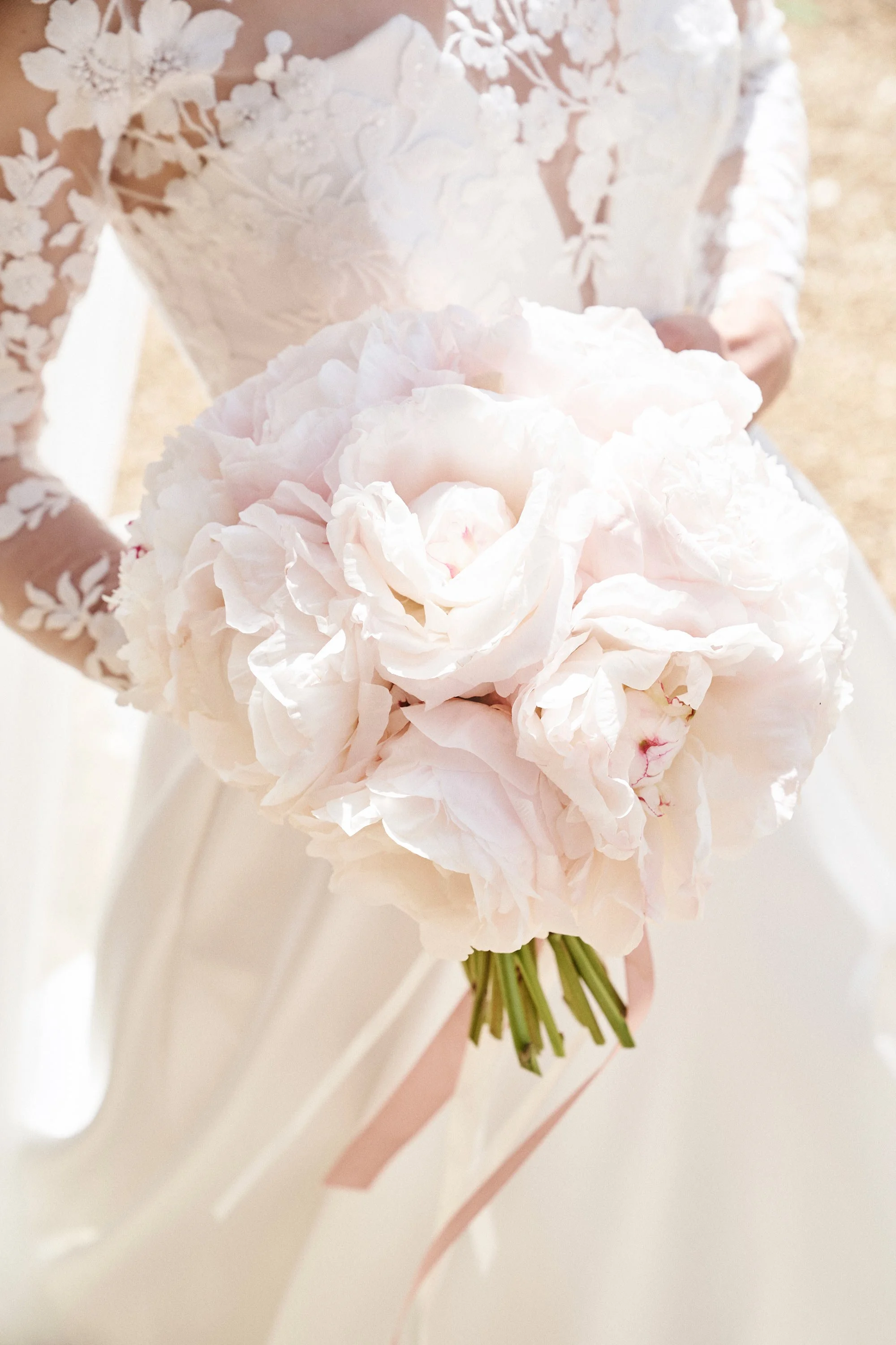 bridal bouquet of pale pink peonies